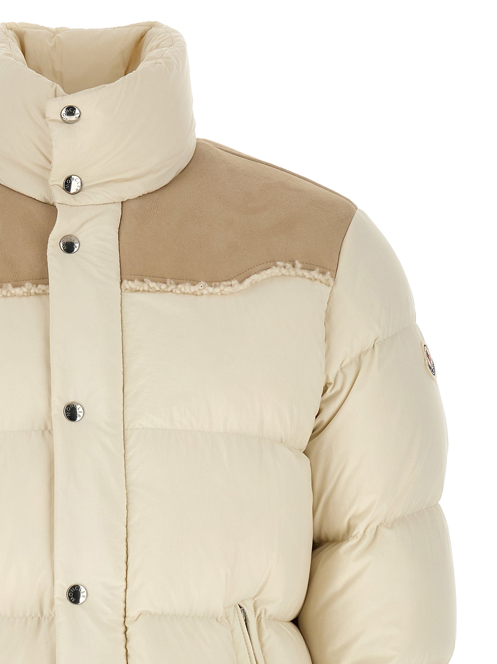 Indulge in the Moncler Beige Polyamide Full-Length Jacket, a masterpiece of luxurious quilted nylon and premium goose down, epitomizing sophistication and warmth.