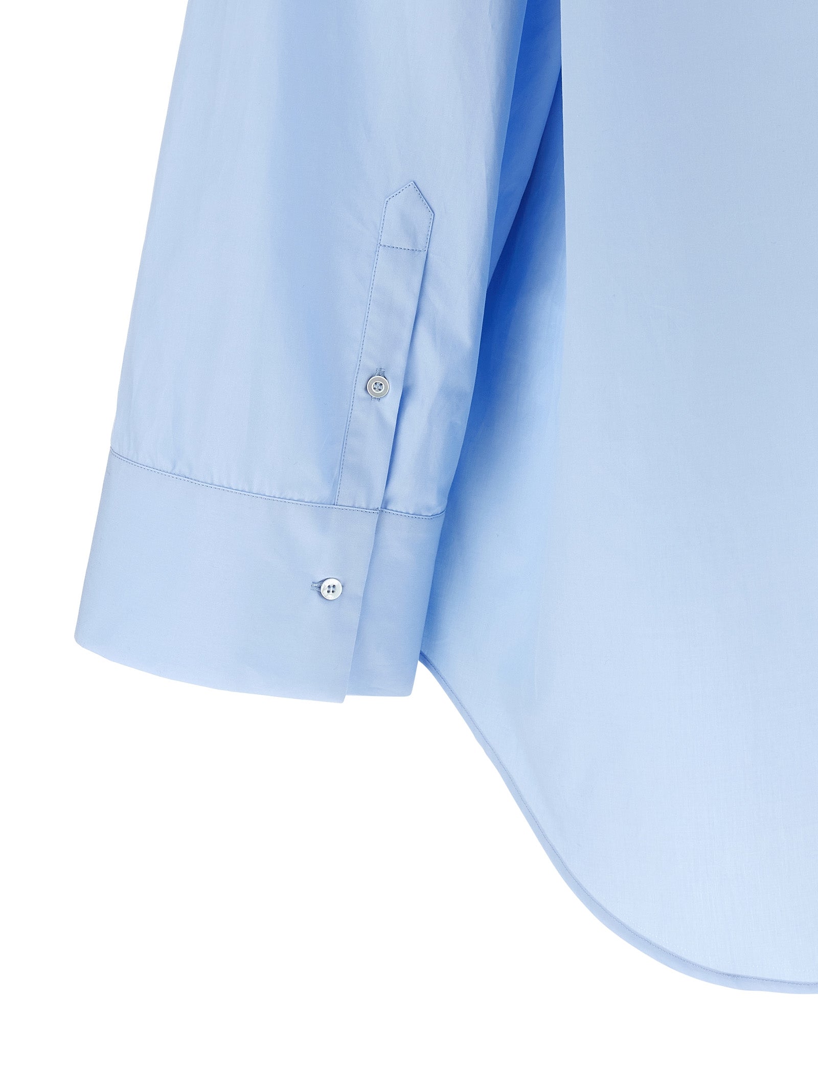 Discover the Fabiana Filippi Blue Cotton Blouse, a masterpiece of Italian craftsmanship, blending luxurious comfort and timeless elegance for the discerning individual.