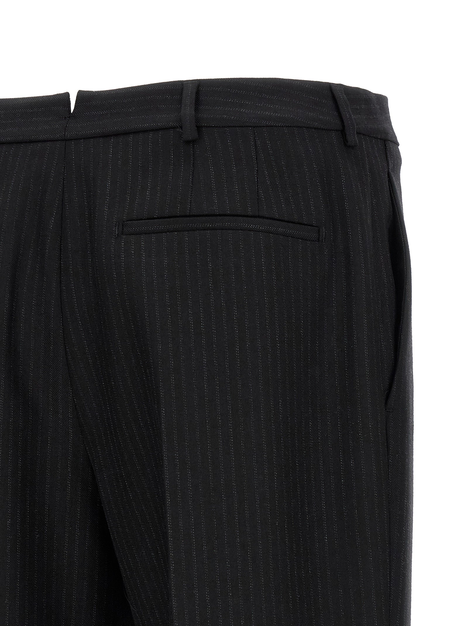 Elevate your wardrobe with Saint Laurent's Black Wool Dress Pants, expertly tailored in Italy from luxurious wool, embodying timeless elegance and sophistication.