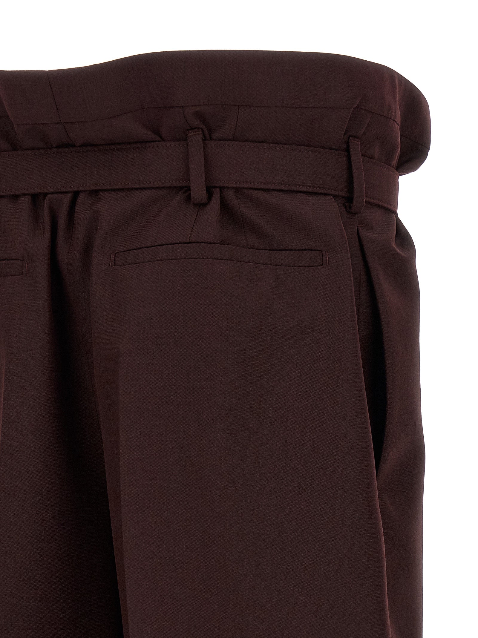 Elevate your wardrobe with Saint Laurent's Purple Wool Casual Pants, a masterpiece of Italian craftsmanship that embodies modern luxury and timeless elegance.