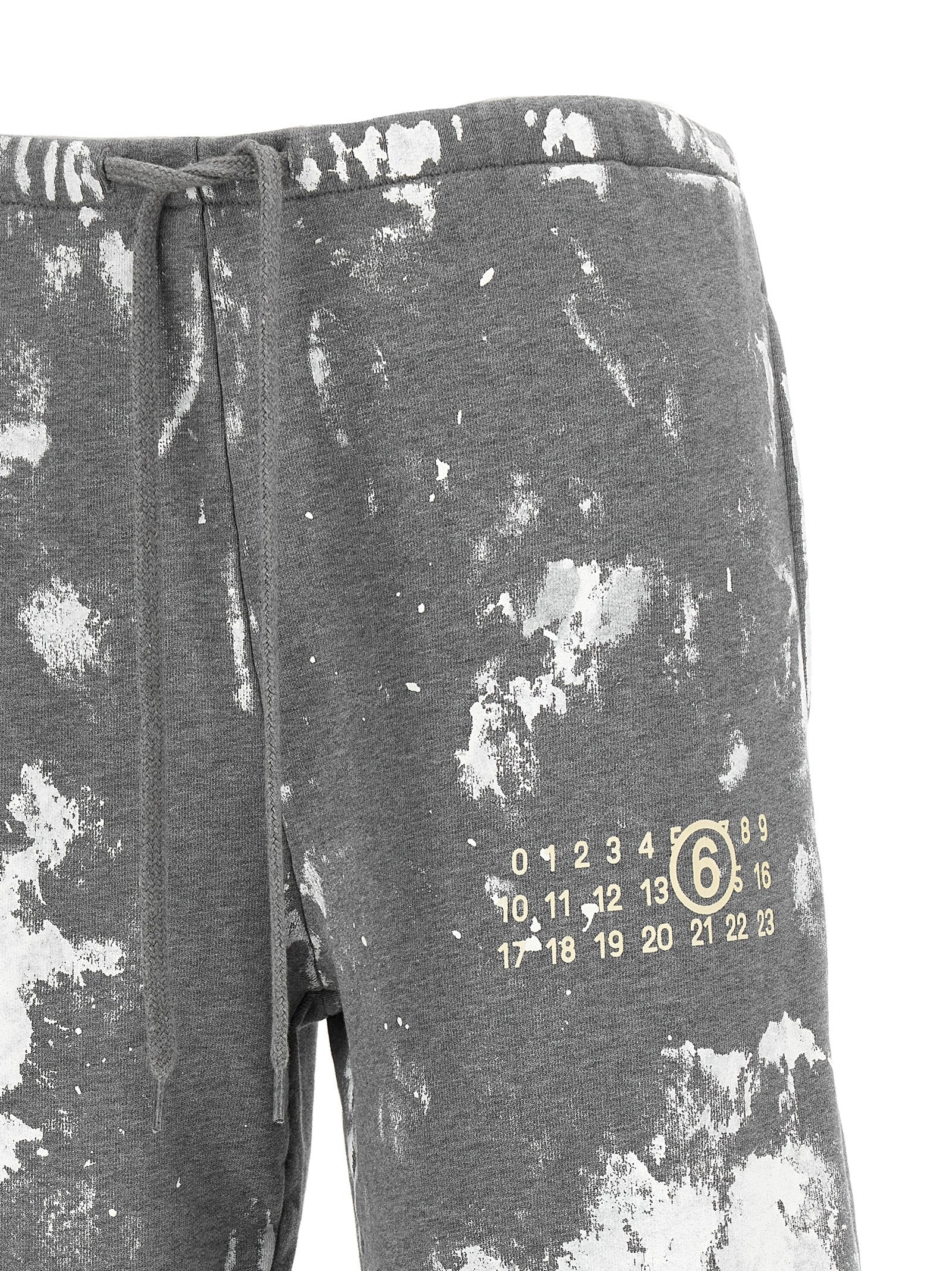 Experience the artistry of MM6 Maison Margiela's gray cotton joggers, where avant-garde design meets unparalleled comfort, perfect for the discerning individual.
