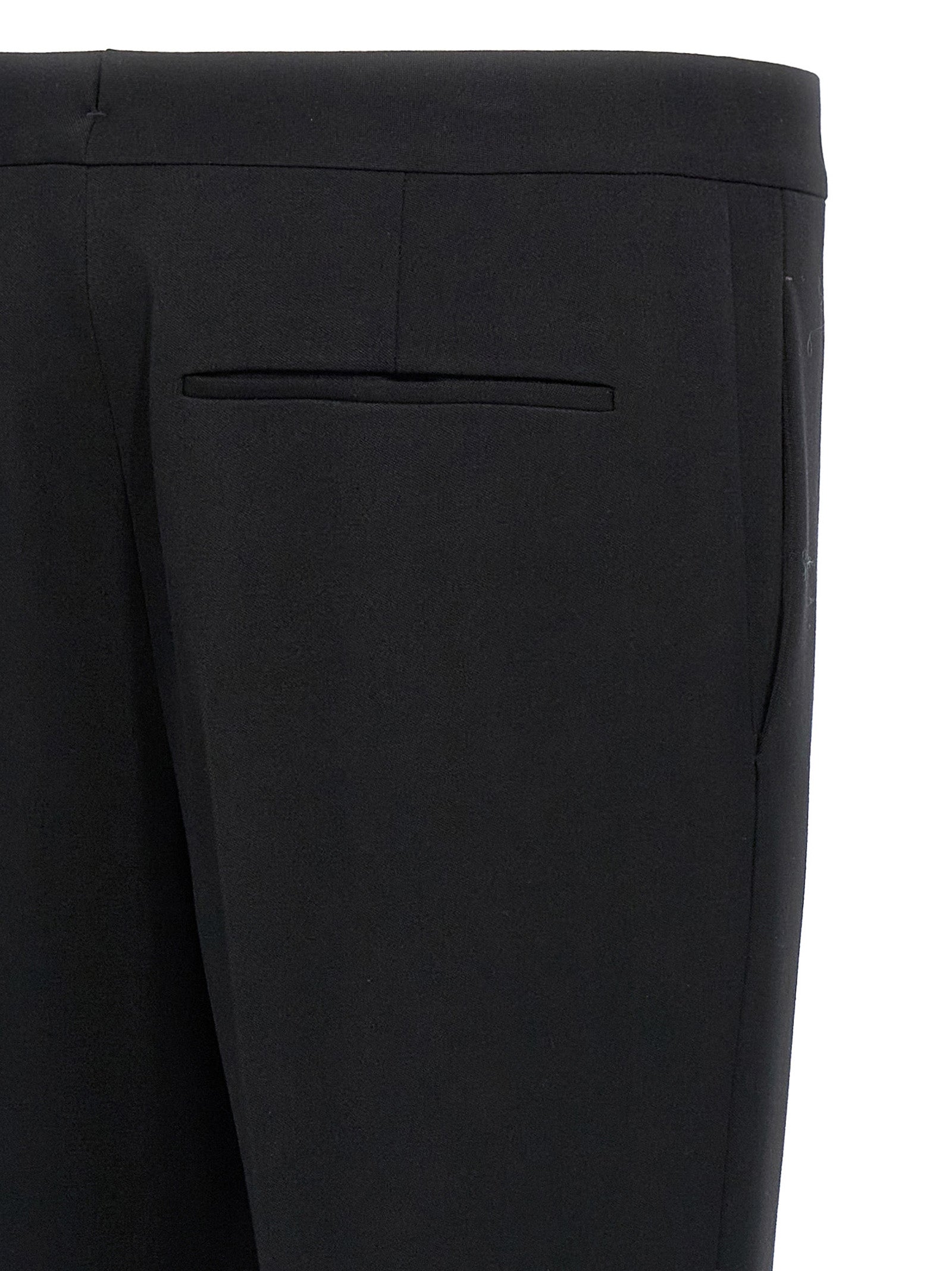 Elevate your wardrobe with Saint Laurent Black Wool Dress Pants, where exquisite craftsmanship meets timeless elegance, perfect for the discerning individual.