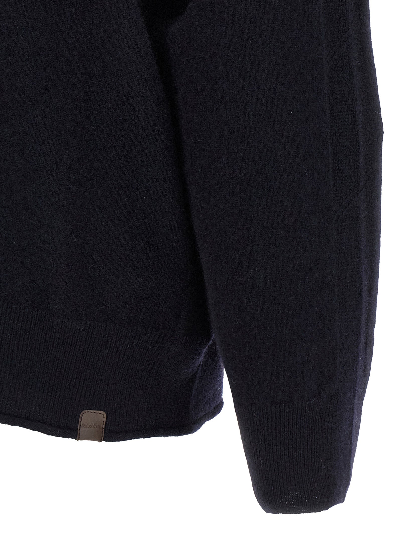 Indulge in the Max Mara Blue Cashmere Cardigan, a masterpiece of artisanal craftsmanship, enveloping you in luxurious warmth and timeless elegance for every occasion.