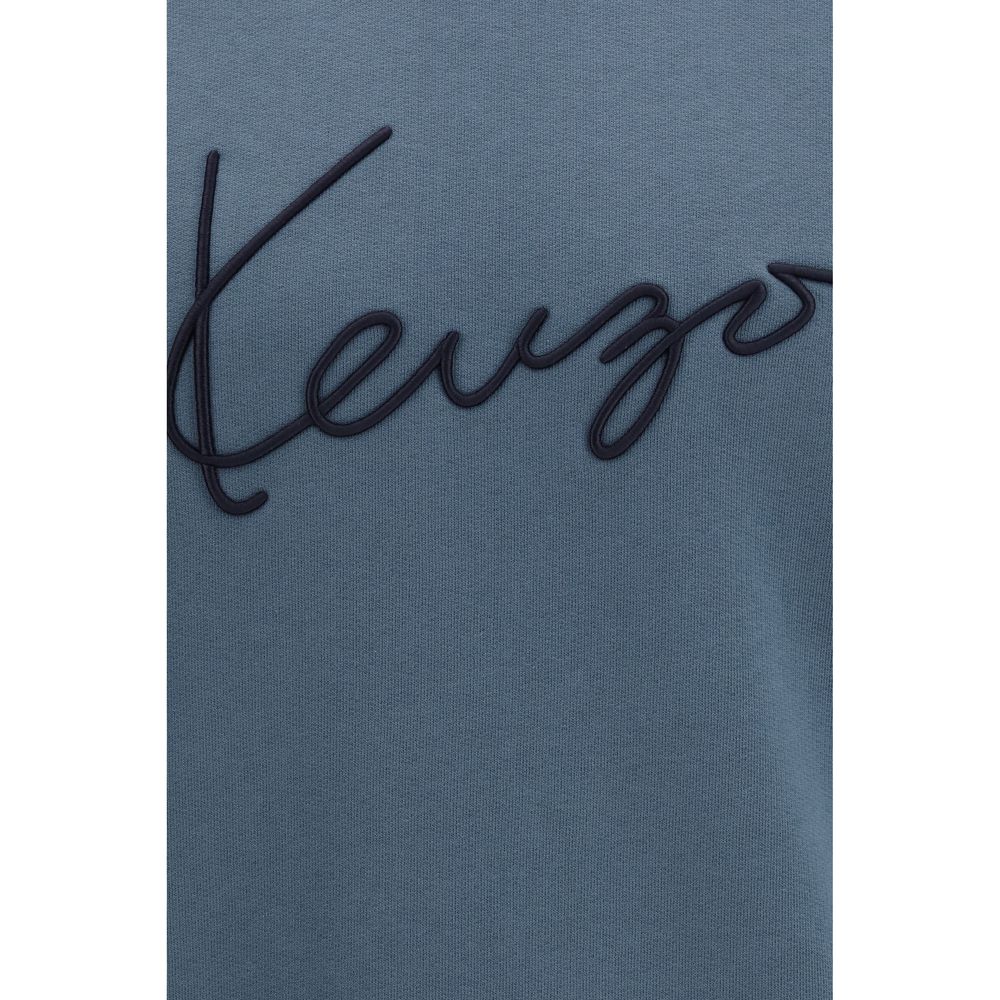 Indulge in the Kenzo Blue Cotton Sweatshirt, a masterpiece of artisanal luxury crafted from soft unbrushed fleece, perfect for elevating any wardrobe with timeless elegance.