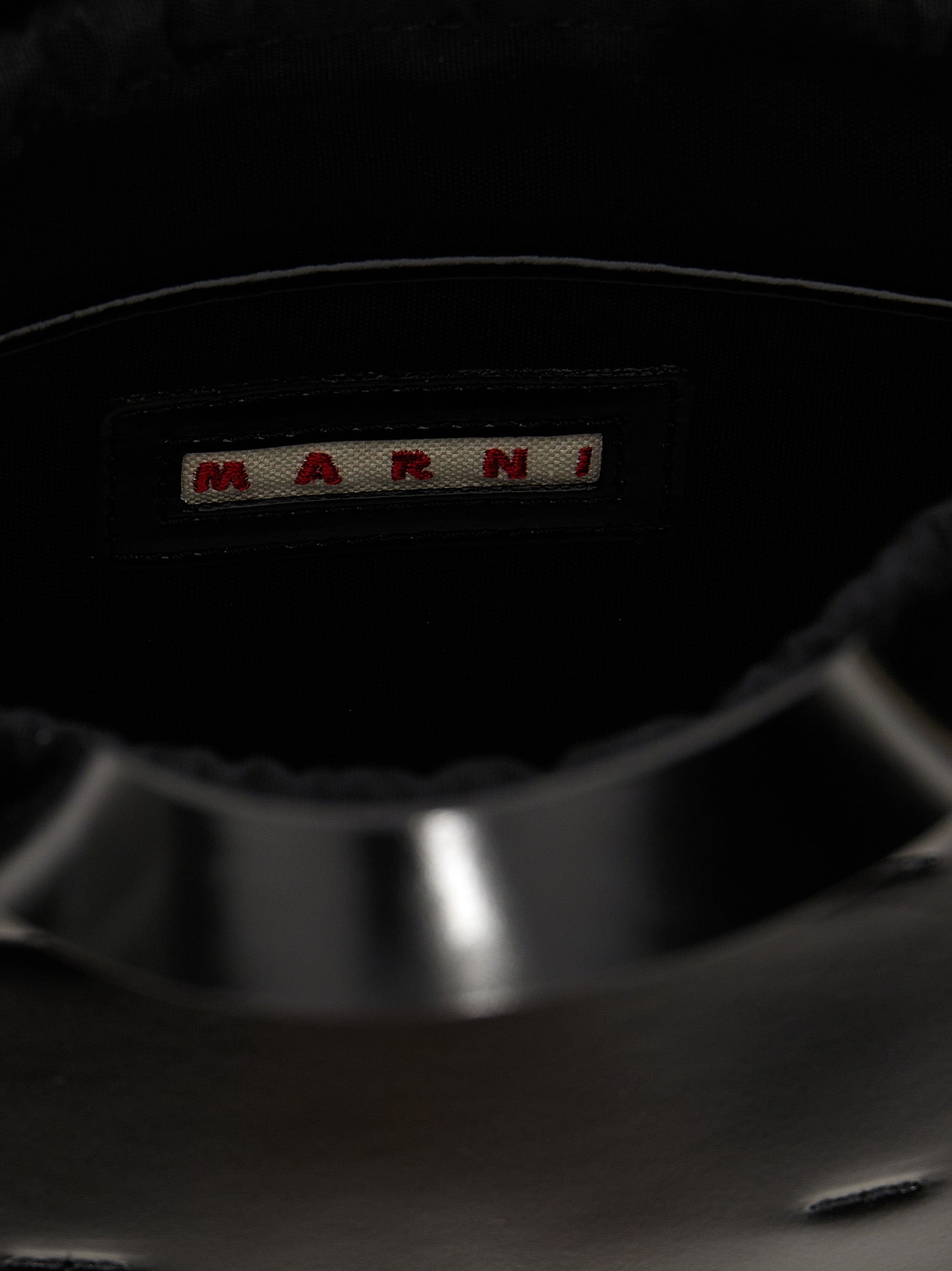 Discover the Marni Black Calfskin Handbag, a masterpiece of Italian craftsmanship, blending elegance and versatility for the discerning individual.