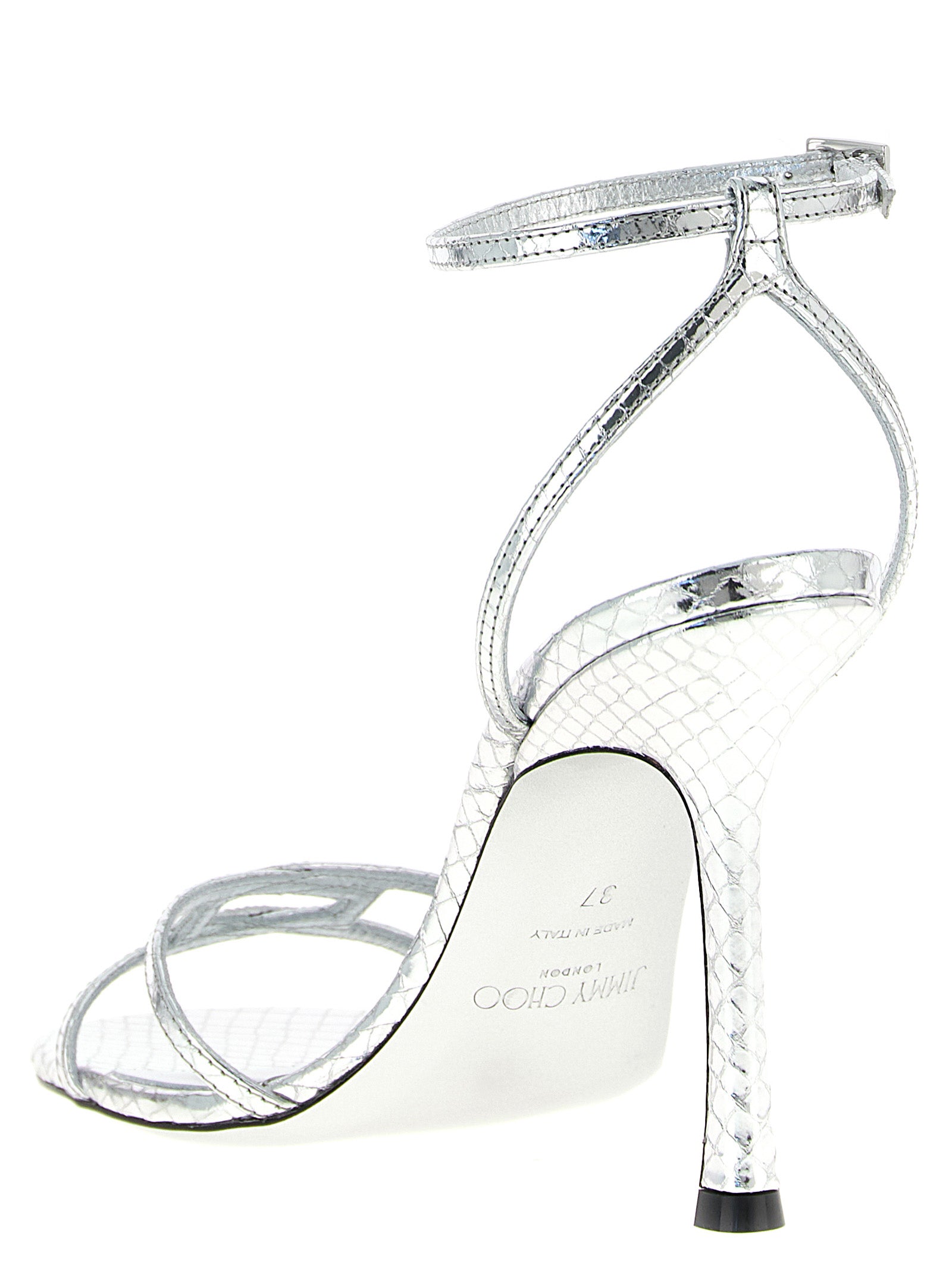 Elevate your elegance with Jimmy Choo's Silver Leather Stiletto Heel Sandals, a 1998 masterpiece crafted in Italy, embodying timeless luxury and sophistication.