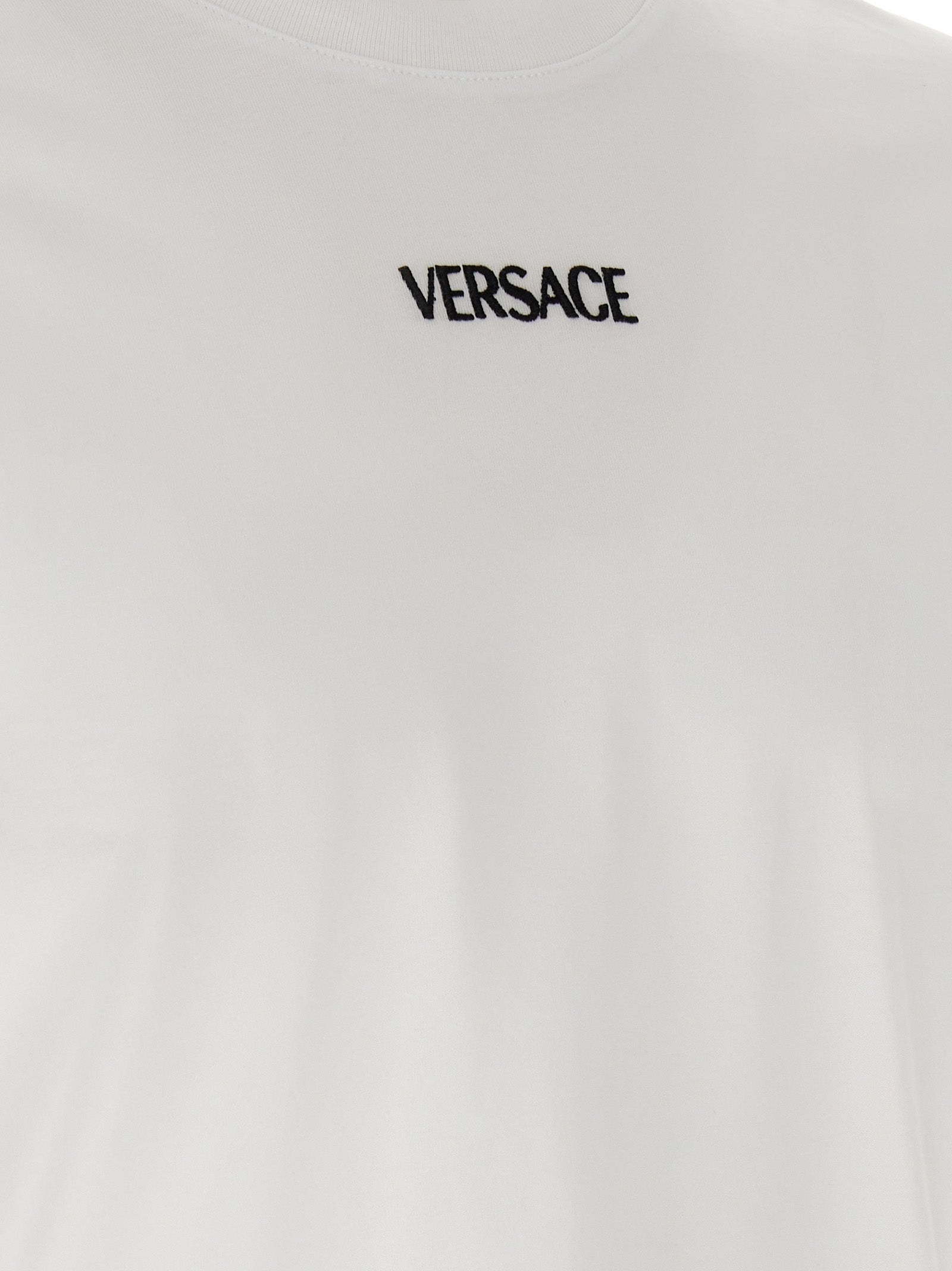 Elevate your wardrobe with the Versace White Cotton T-Shirt, a luxurious essential crafted from 100% cotton, embodying sophistication and timeless elegance.
