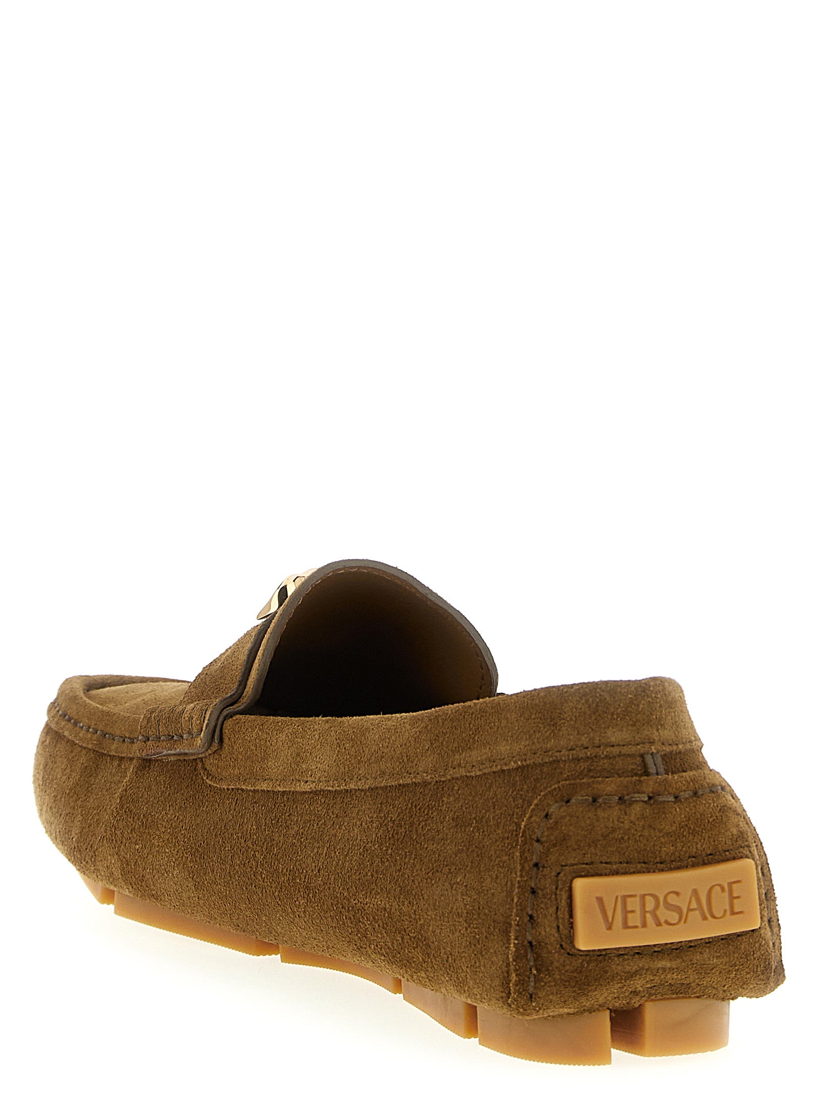 Elevate your elegance with Versace's Brown Calfskin Slip-On Loafers, where exquisite craftsmanship meets timeless luxury, perfect for the discerning trendsetter.