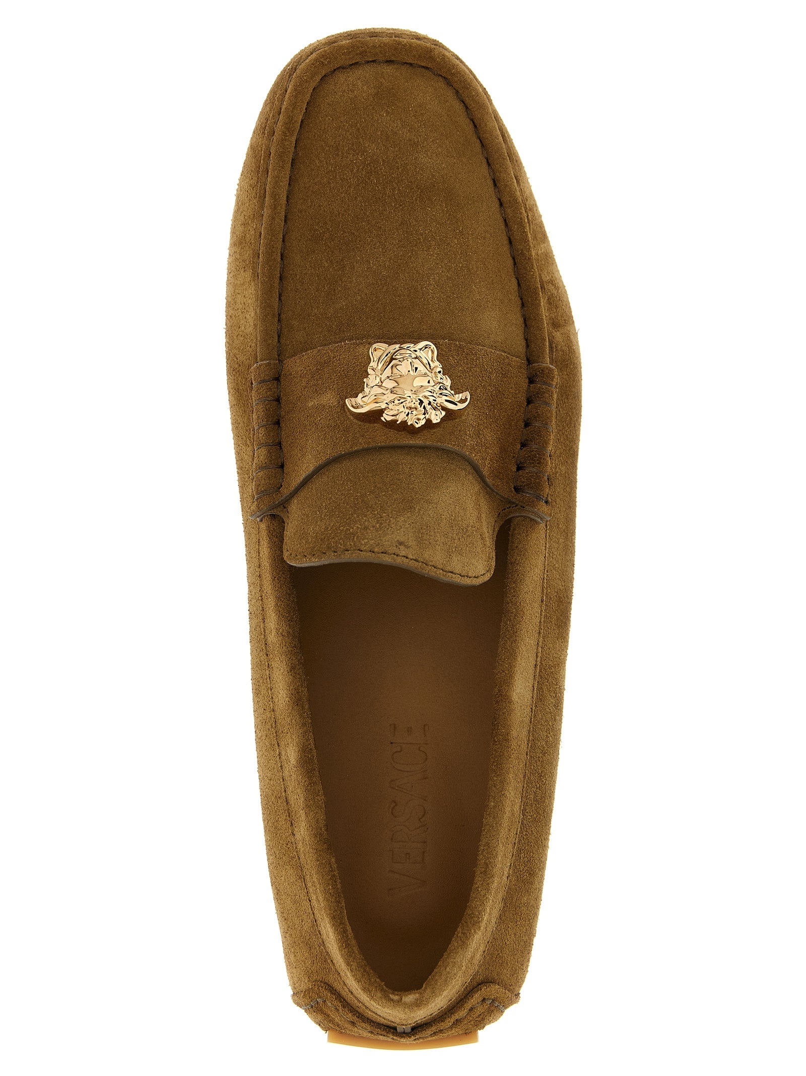 Elevate your style with Versace's Brown Calfskin Slip-On Loafers, where exquisite craftsmanship meets luxurious comfort, perfect for the discerning trendsetter.