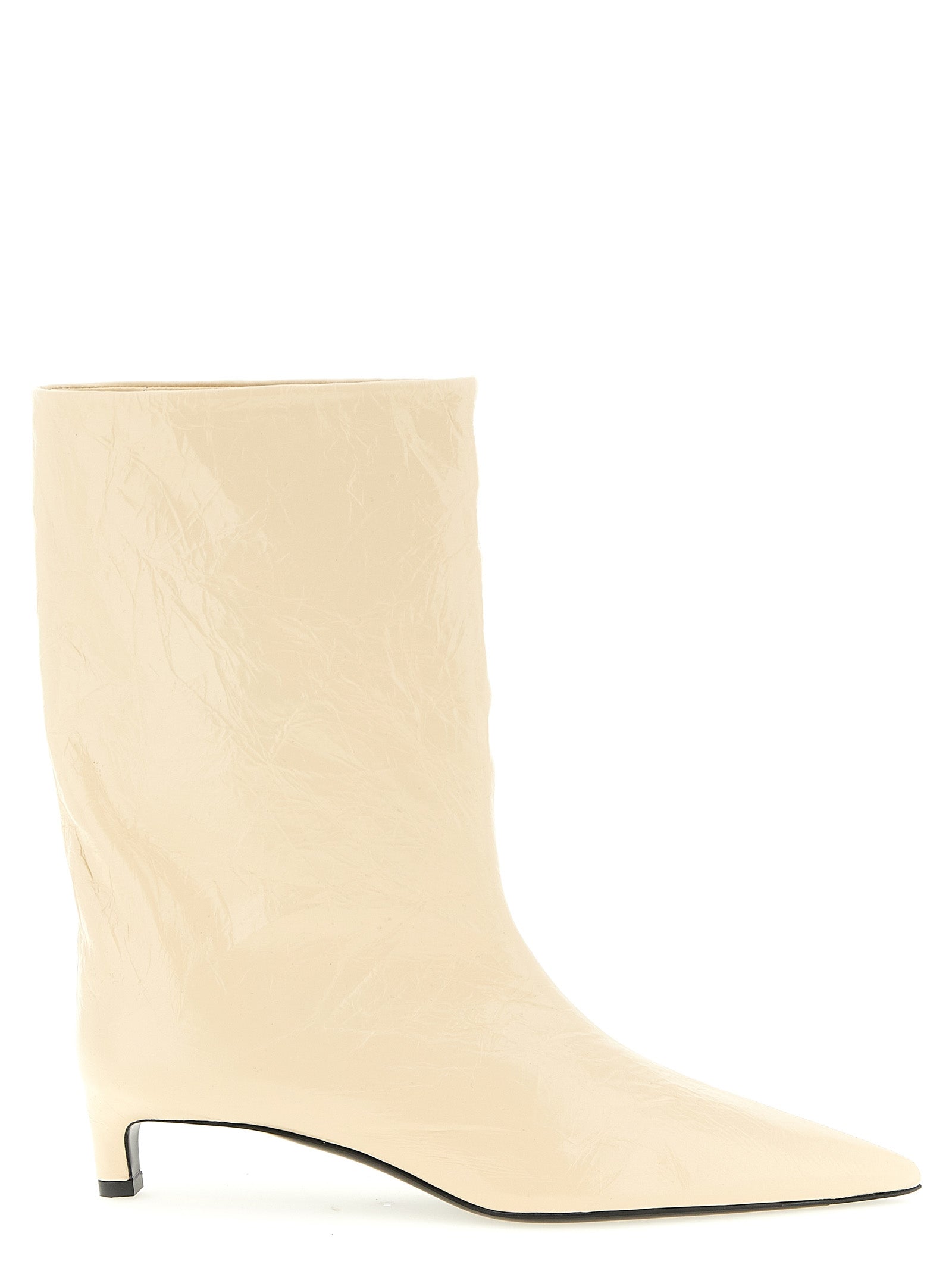 Experience the allure of Jil Sander's Beige Calfskin Ankle Boots, where artisanal craftsmanship meets modern elegance, redefining luxury for the discerning individual.