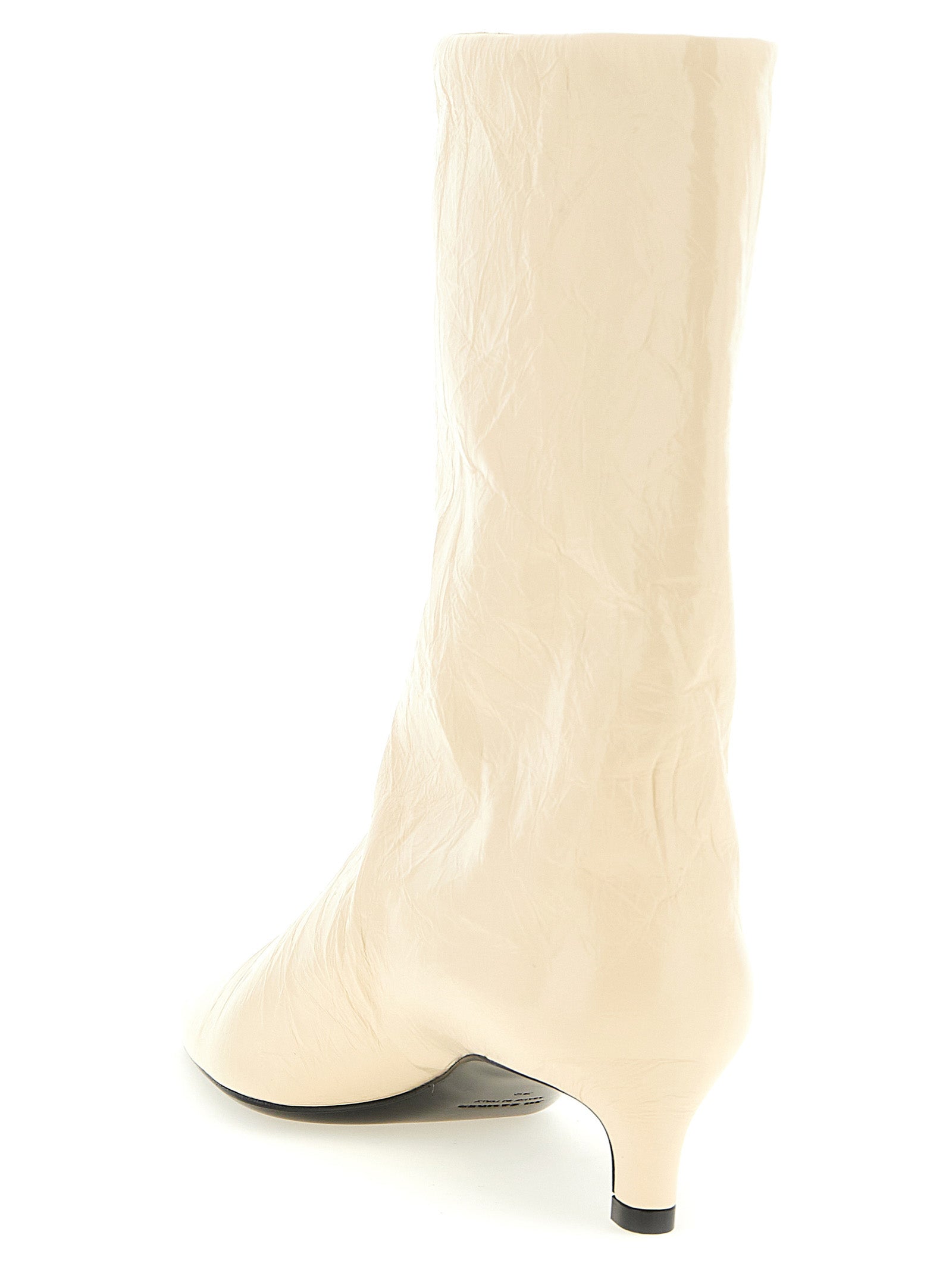 Experience the allure of Jil Sander's Beige Calfskin Ankle Boots, where artisanal craftsmanship meets modern elegance, elevating your style with luxurious sophistication.