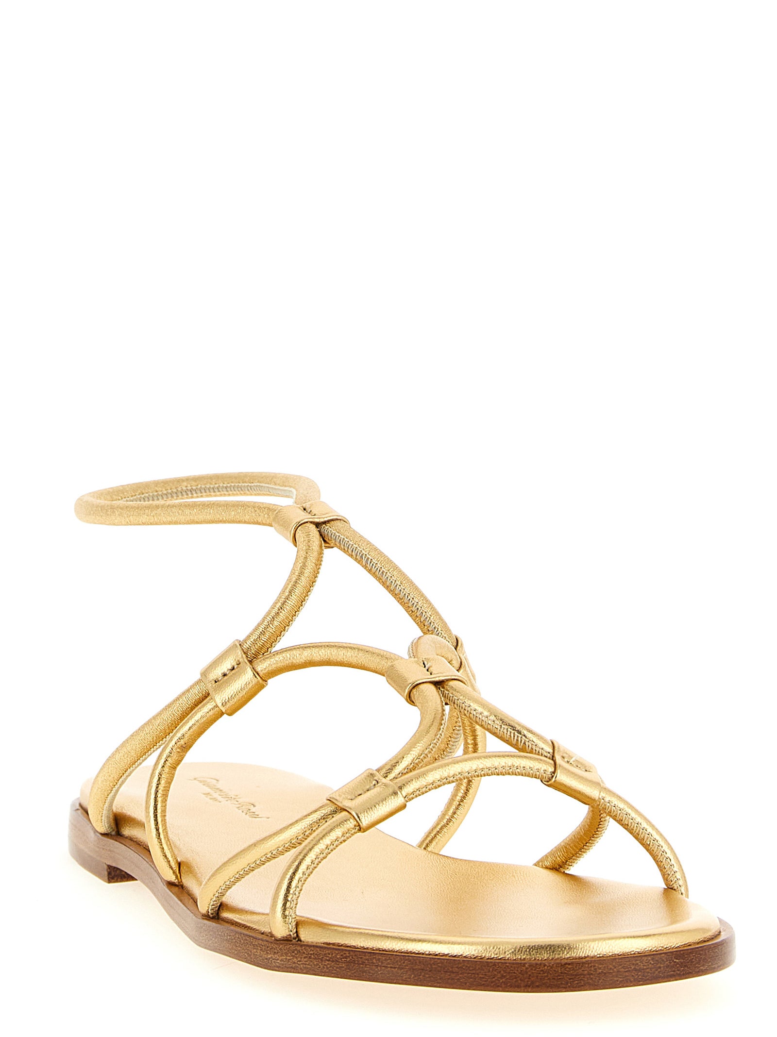 Indulge in Gianvito Rossi's gold lamb leather flat sandals, where Italian craftsmanship meets sophisticated elegance, perfect for the discerning individual seeking timeless luxury.