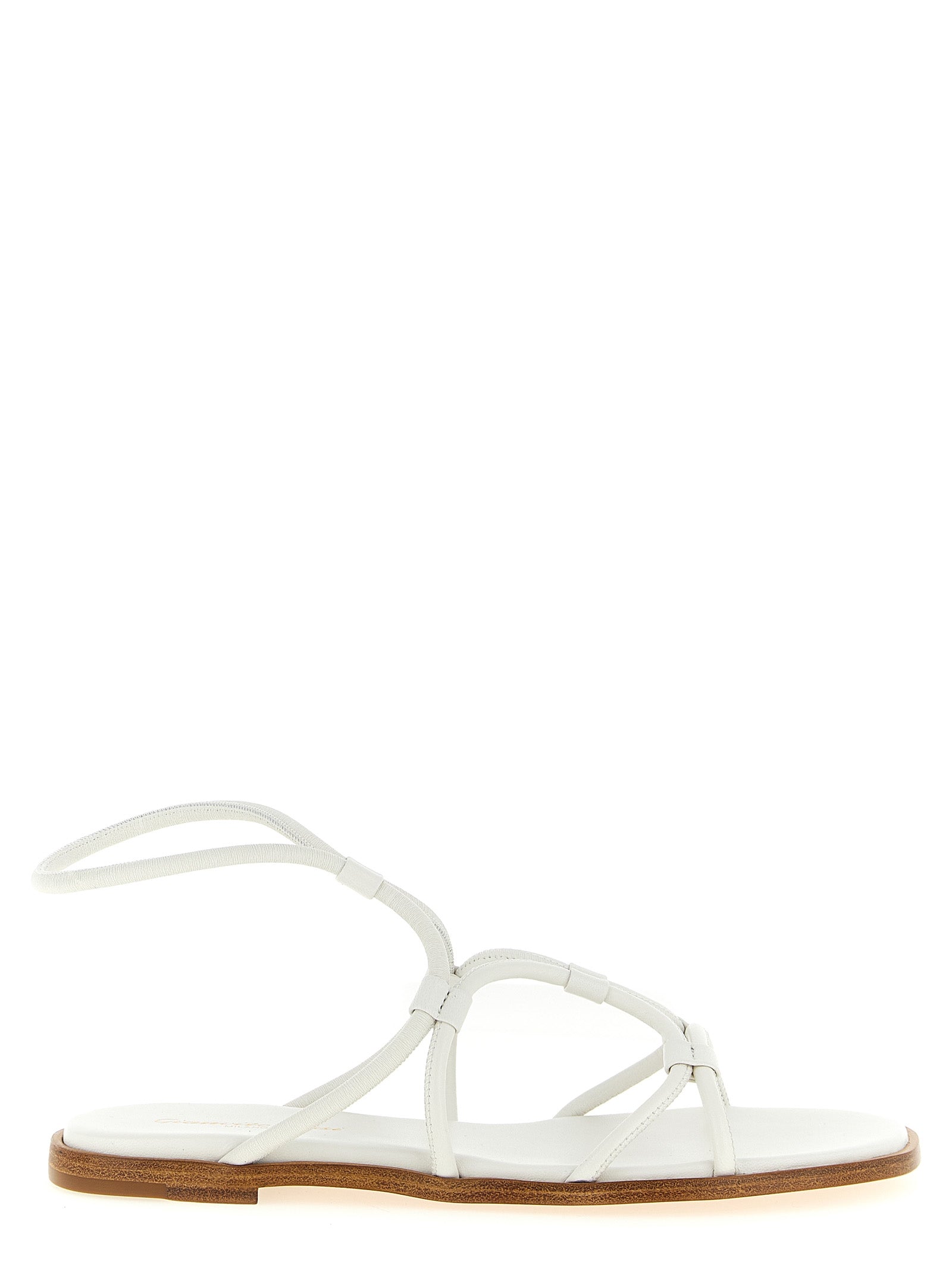 Experience the exquisite Gianvito Rossi White Lamb Leather Flat Sandals, where Italian craftsmanship meets timeless elegance, perfect for the discerning fashion connoisseur.
