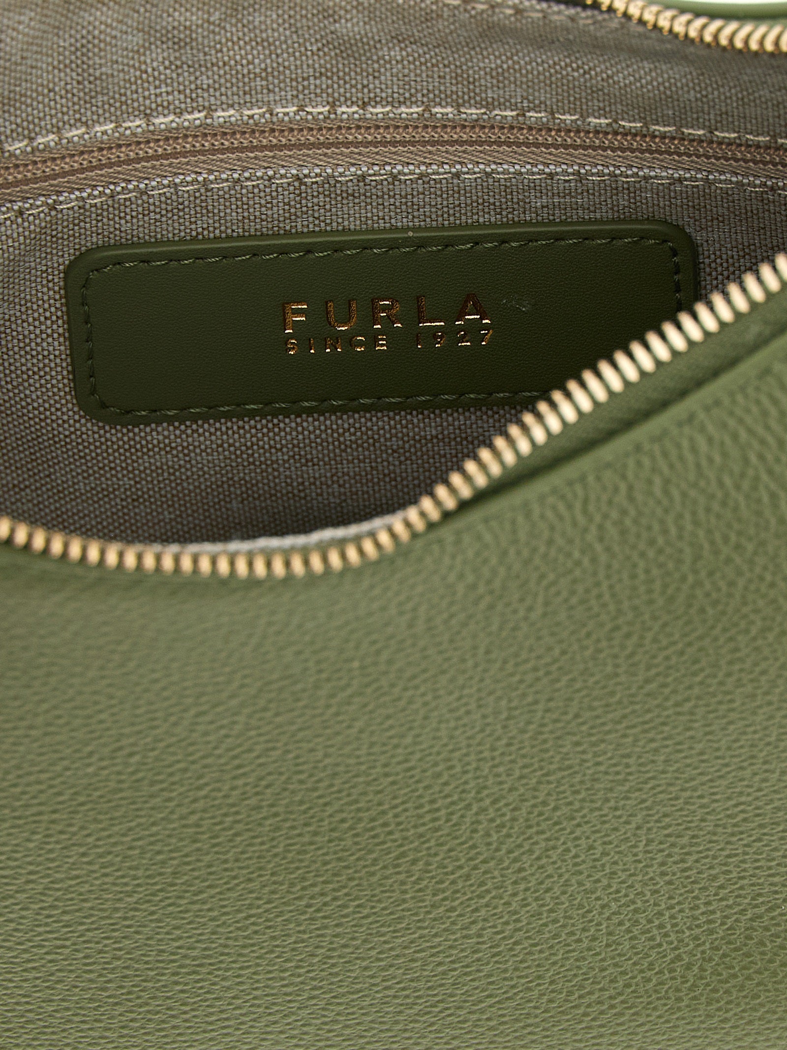 Indulge in the exquisite Furla Goccia Bicolor Calfskin Shoulder Bag, a harmonious blend of artisanal craftsmanship and luxurious design, perfect for the discerning connoisseur.