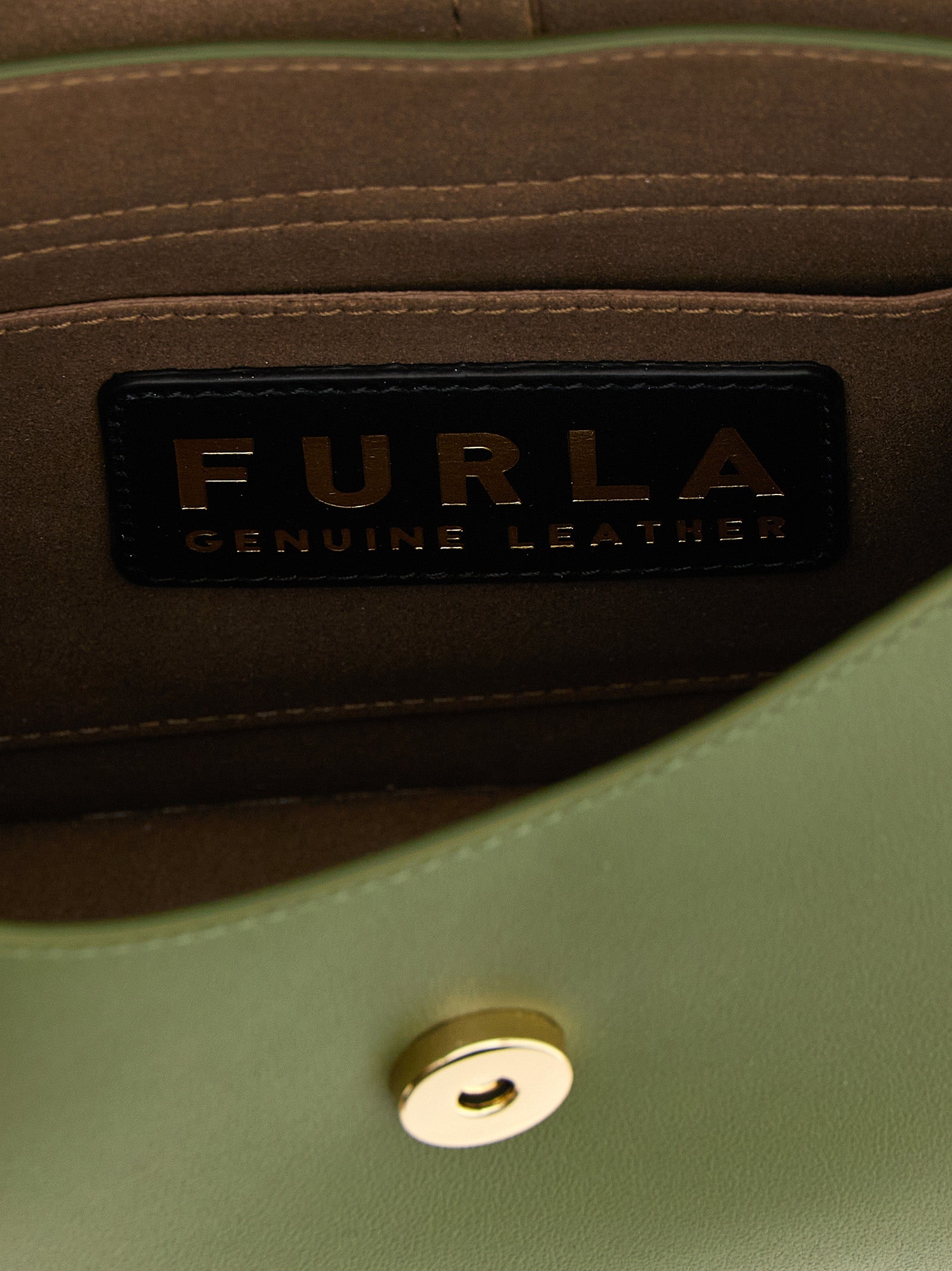 Indulge in the exquisite Furla Bicolor Calfskin Shoulder Bag, a masterpiece of artisanal luxury crafted from rich green calfskin, perfect for elevating any ensemble.