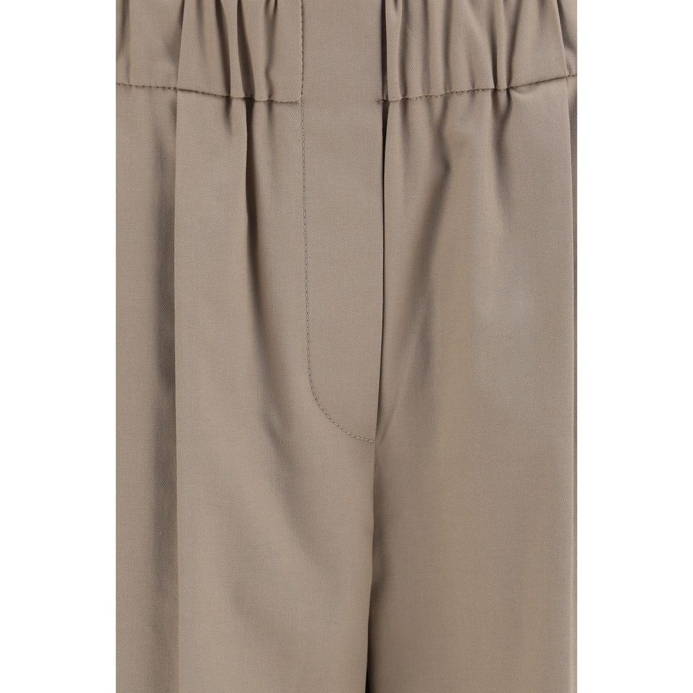 Experience the allure of Brunello Cucinelli's Beige Cotton Casual Pants, where luxurious craftsmanship meets timeless elegance for the discerning individual.