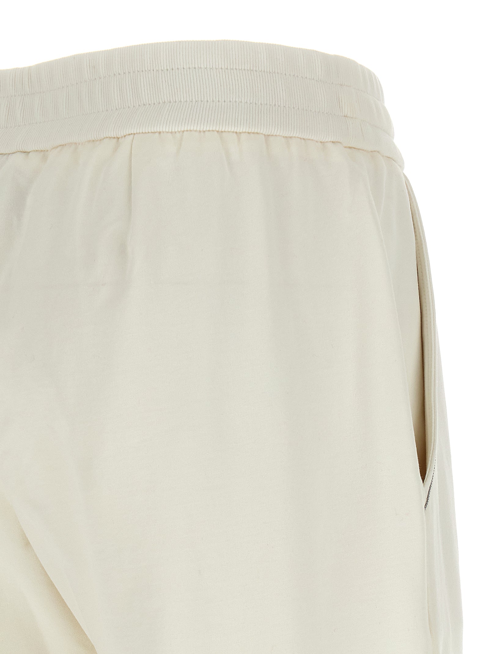 Experience unparalleled elegance with Brunello Cucinelli's White Cotton Joggers, crafted from luxurious brushed cotton for a refined, sophisticated look.