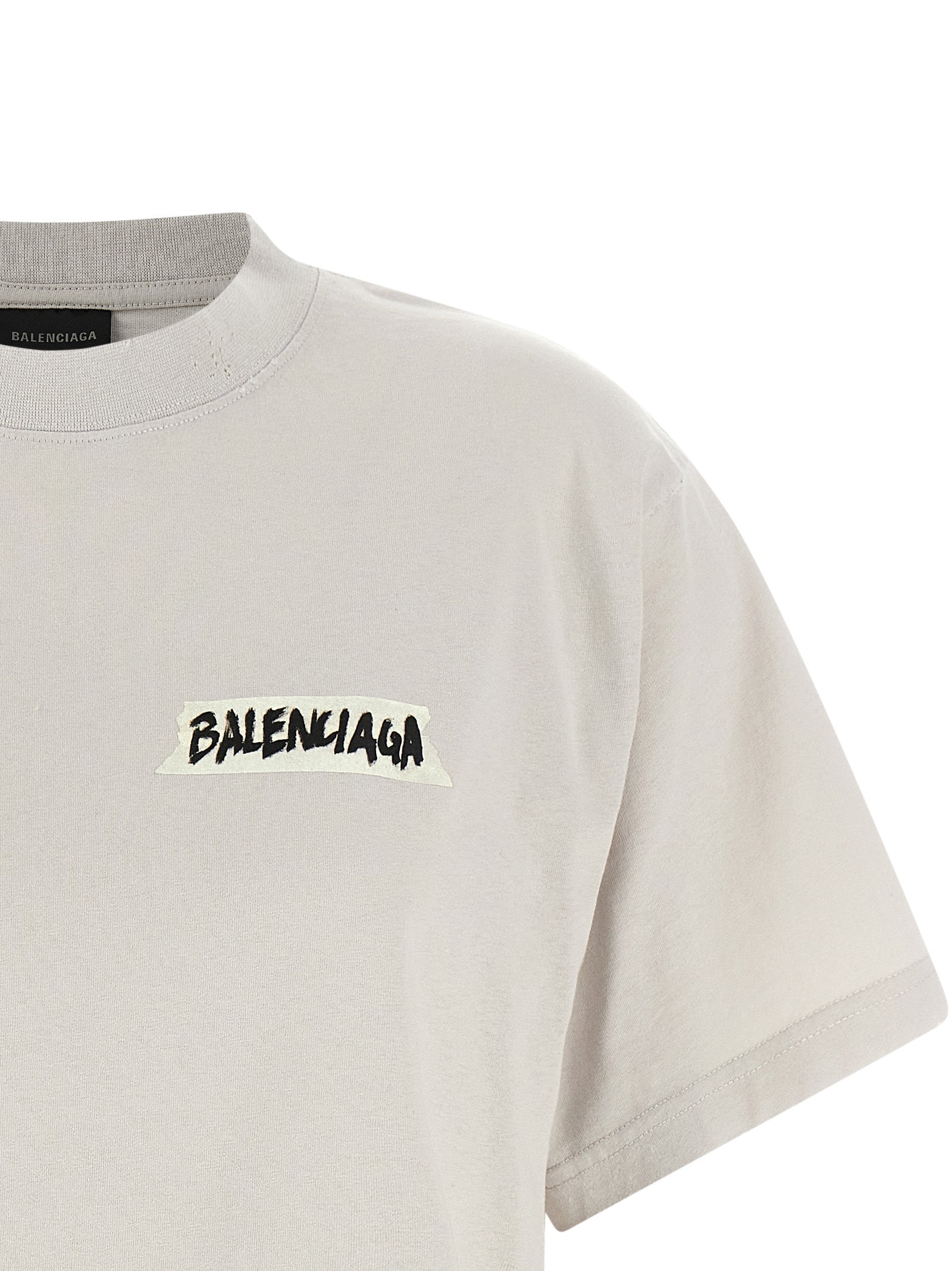 Elevate your wardrobe with the Balenciaga Gray Cotton T-Shirt, a luxurious blend of comfort and bold design, perfect for those who embody sophistication and elegance.