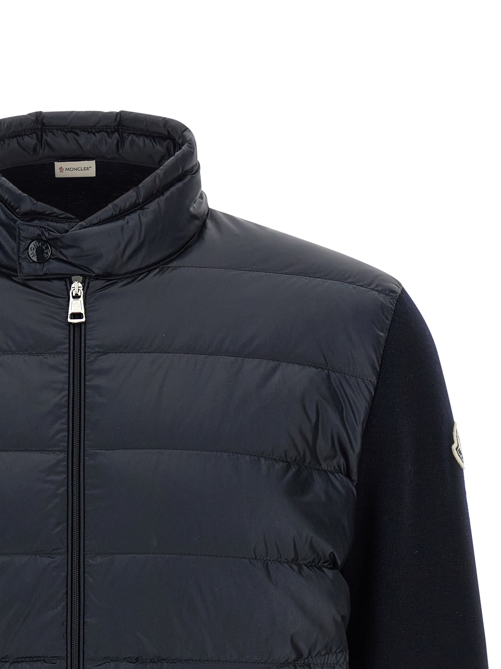 Elevate your style with the Moncler Blue Polyamide Cardigan, a luxurious blend of quilted nylon and fine wool, embodying sophistication and timeless elegance.