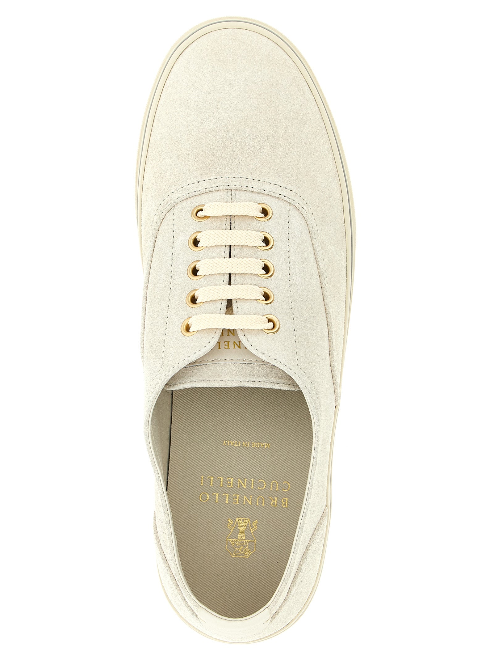 Elevate your style with Brunello Cucinelli's beige calfskin low top sneakers, a seamless blend of Italian craftsmanship and luxurious elegance for the discerning individual.