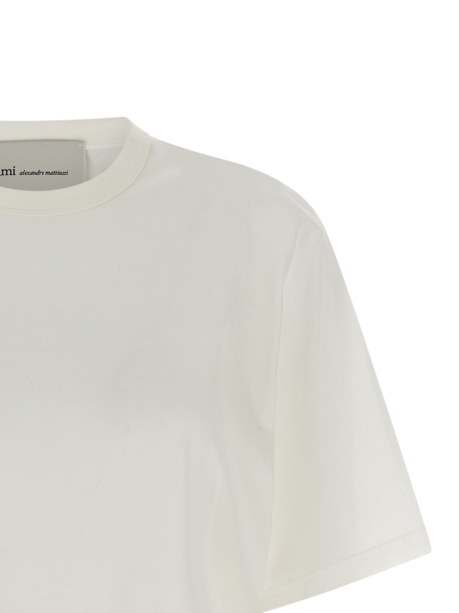 Discover the Ami Paris White Cotton T-Shirt, a blend of sophistication and comfort, perfect for those who embrace bold elegance in every moment.