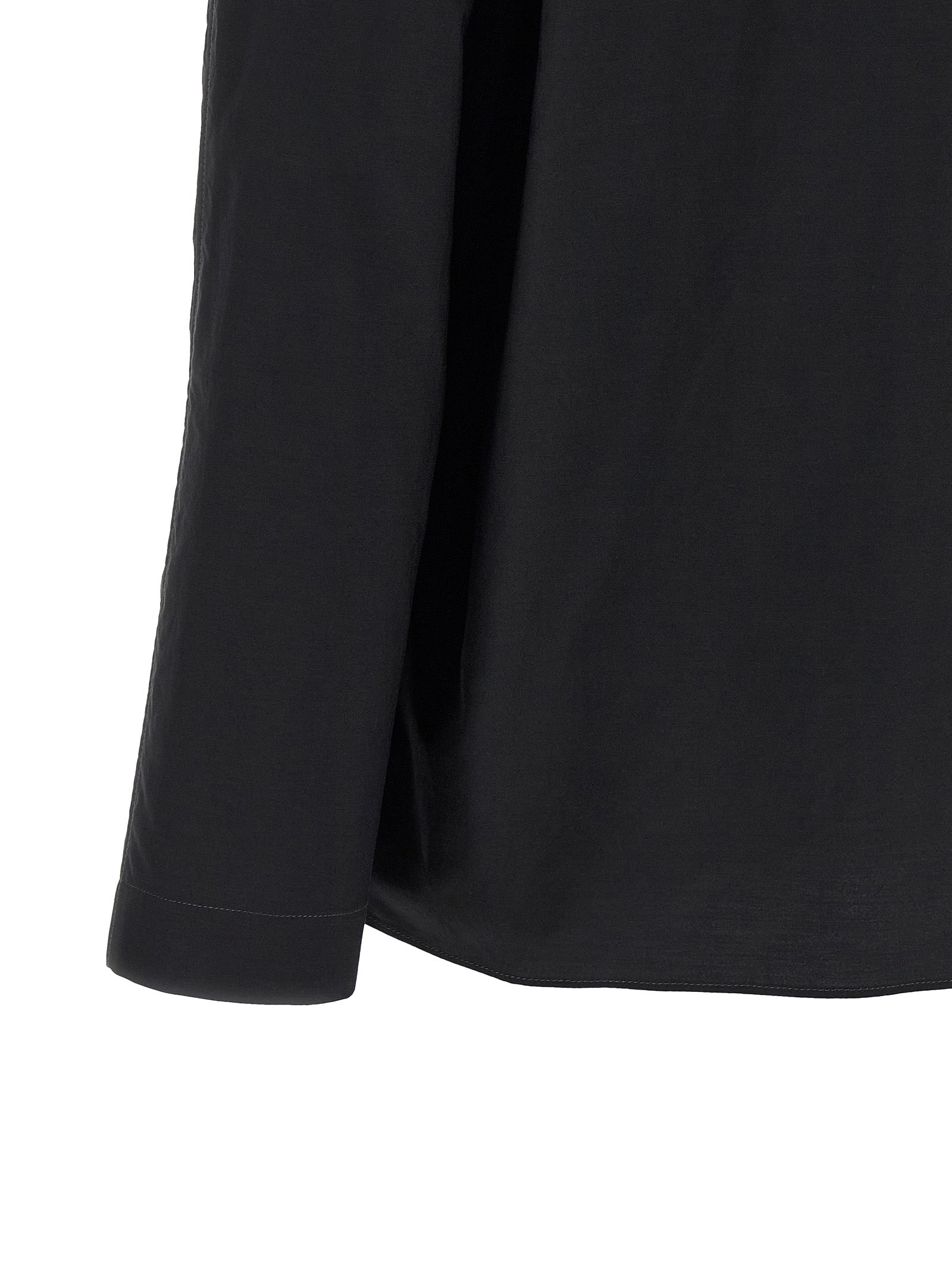 Elevate your wardrobe with the Lemaire Black Cotton Blouse, a sophisticated blend of cotton and silk, embodying timeless elegance and artisanal craftsmanship.