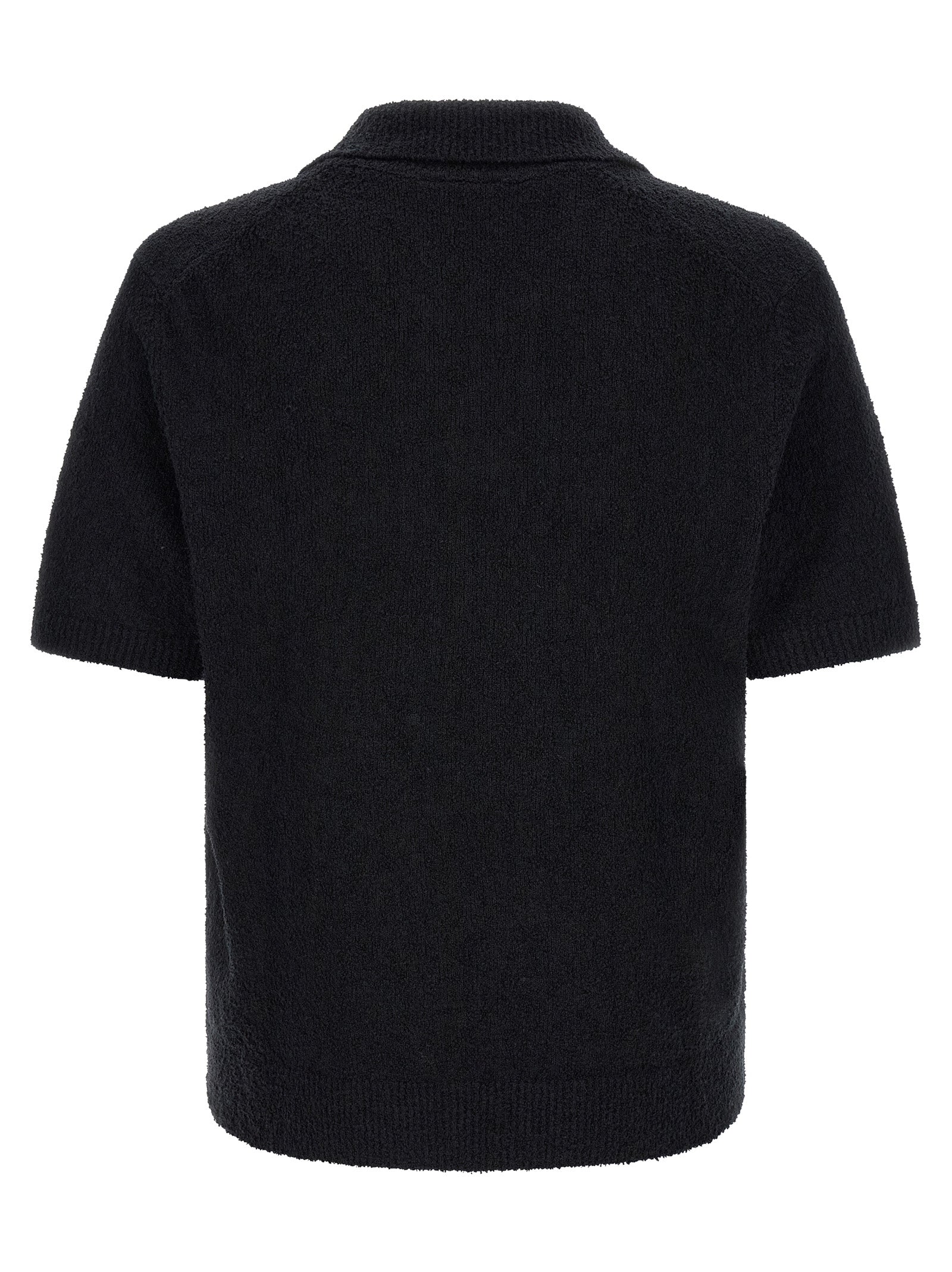 Discover the Lacoste Black Cotton Polo Shirt, a timeless blend of luxury and comfort, perfect for the discerning individual seeking effortless sophistication.