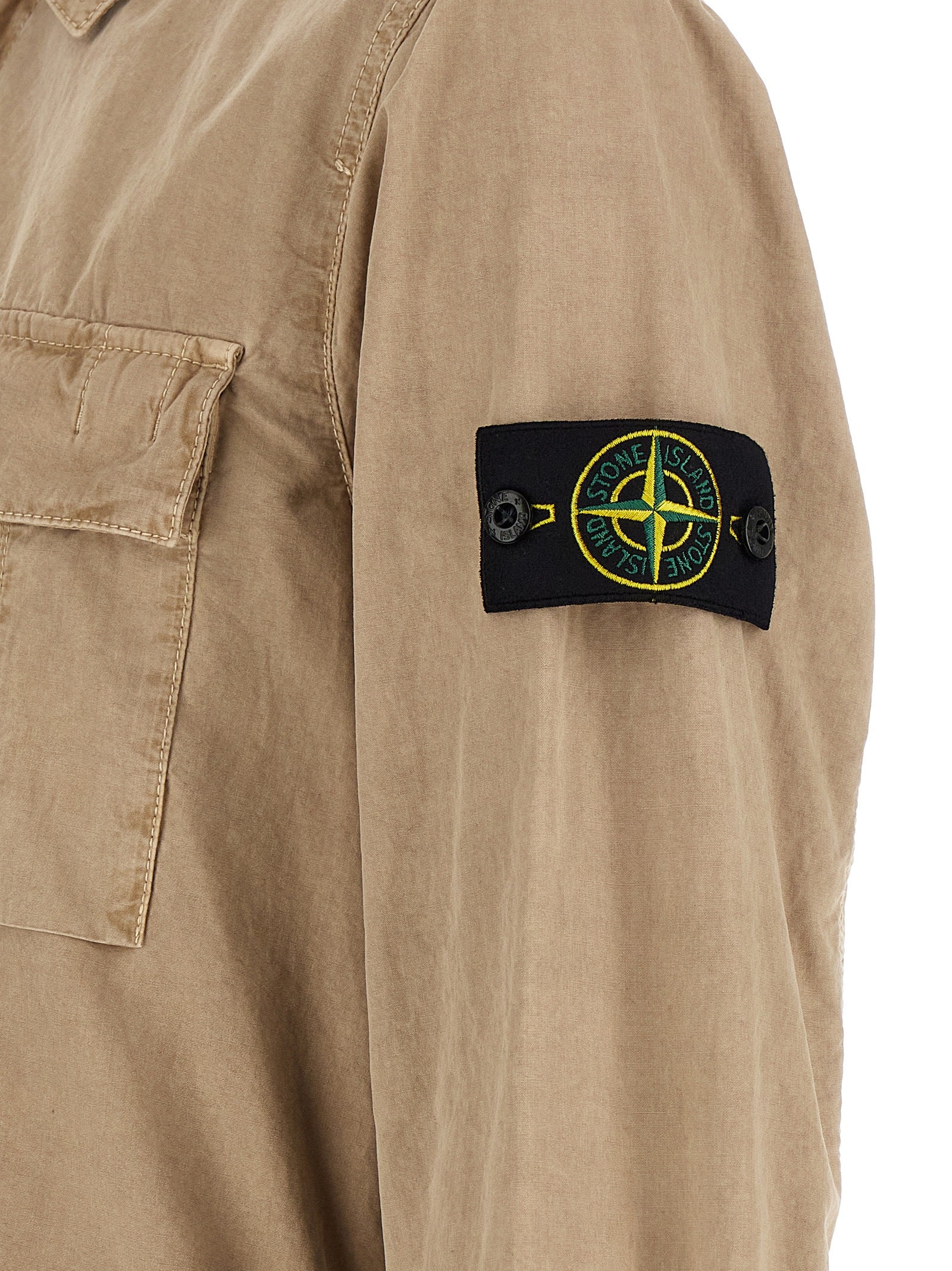 Elevate your wardrobe with the Stone Island Beige Cotton Blouse, a masterpiece of garment-dyed brushed cotton that exudes timeless elegance and effortless sophistication.