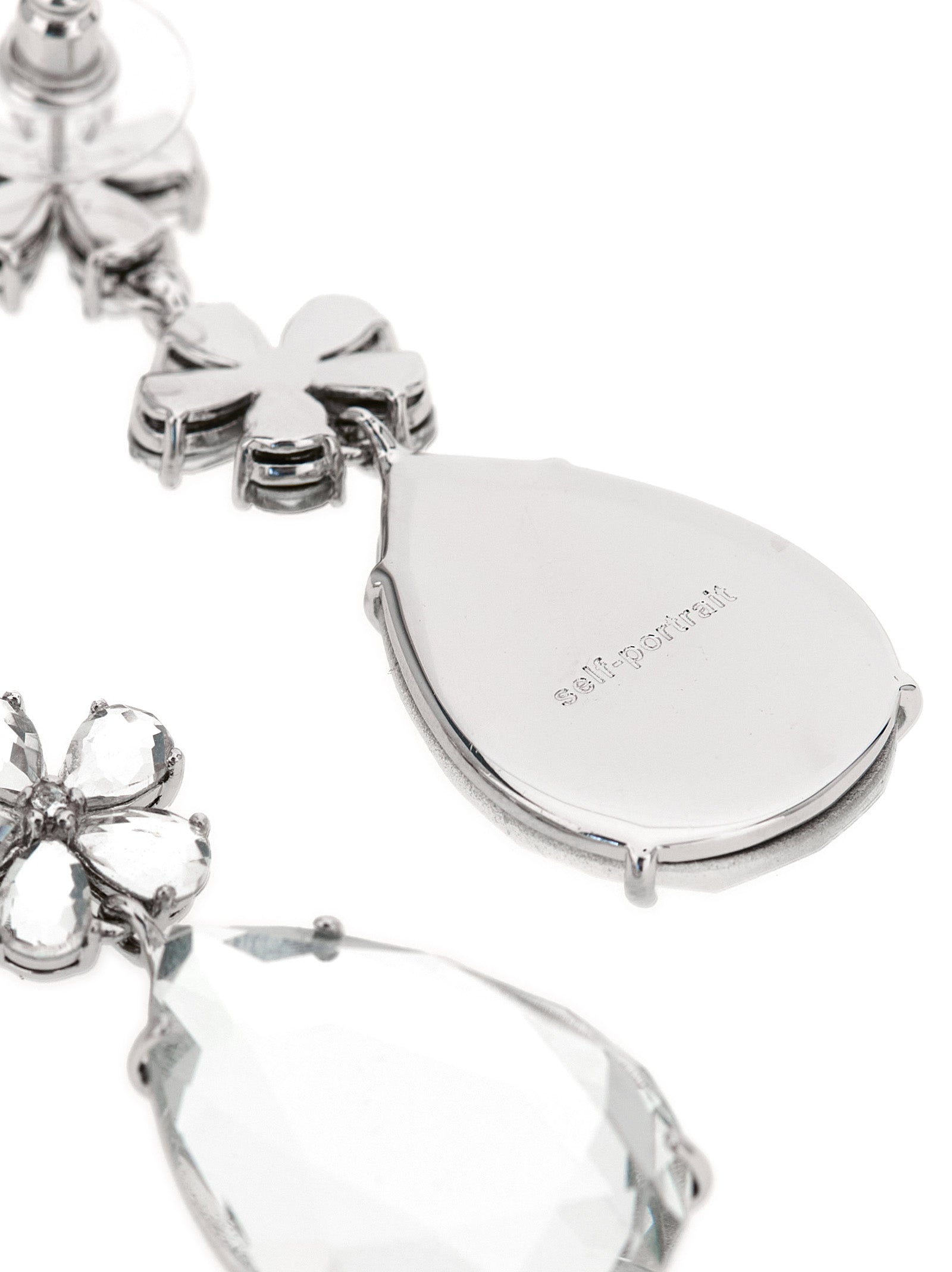 Elevate your elegance with Self-Portrait's Crystal Flower Tiered Earrings, a stunning blend of silver-plated brass and dazzling crystals, perfect for any occasion.
