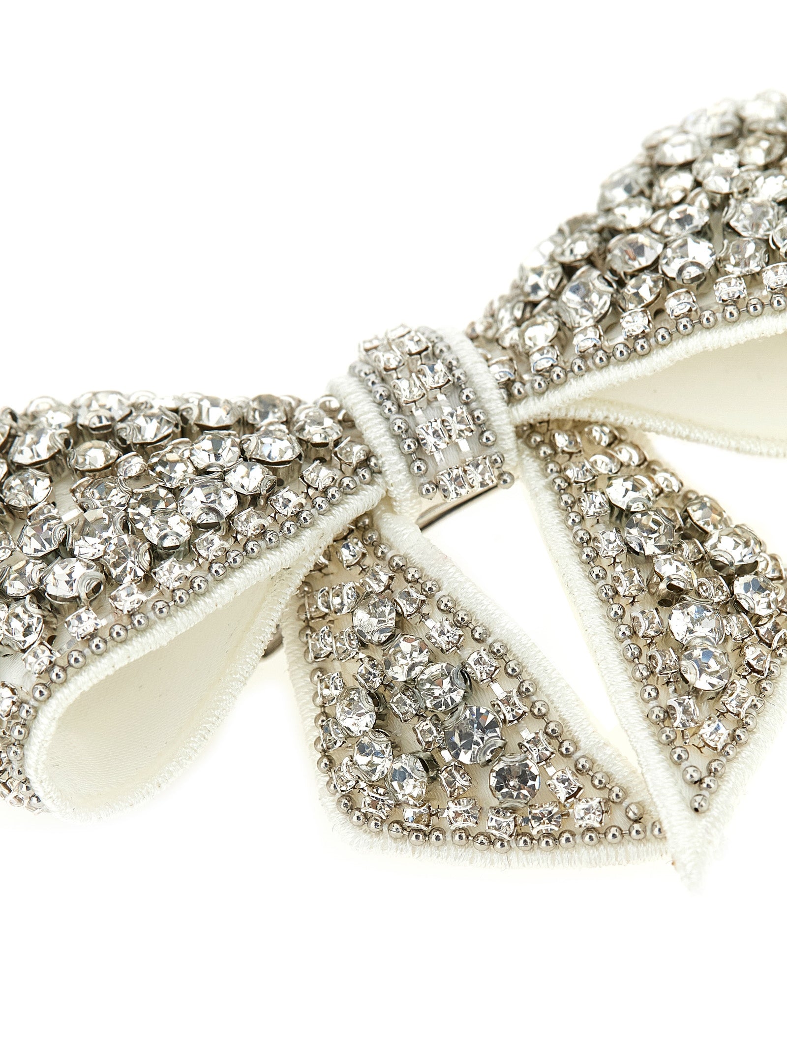 Elevate your elegance with Self-Portrait's Crystal Embellished Bow Hair Clip, a luxurious accessory that transforms any look into a statement of sophistication.