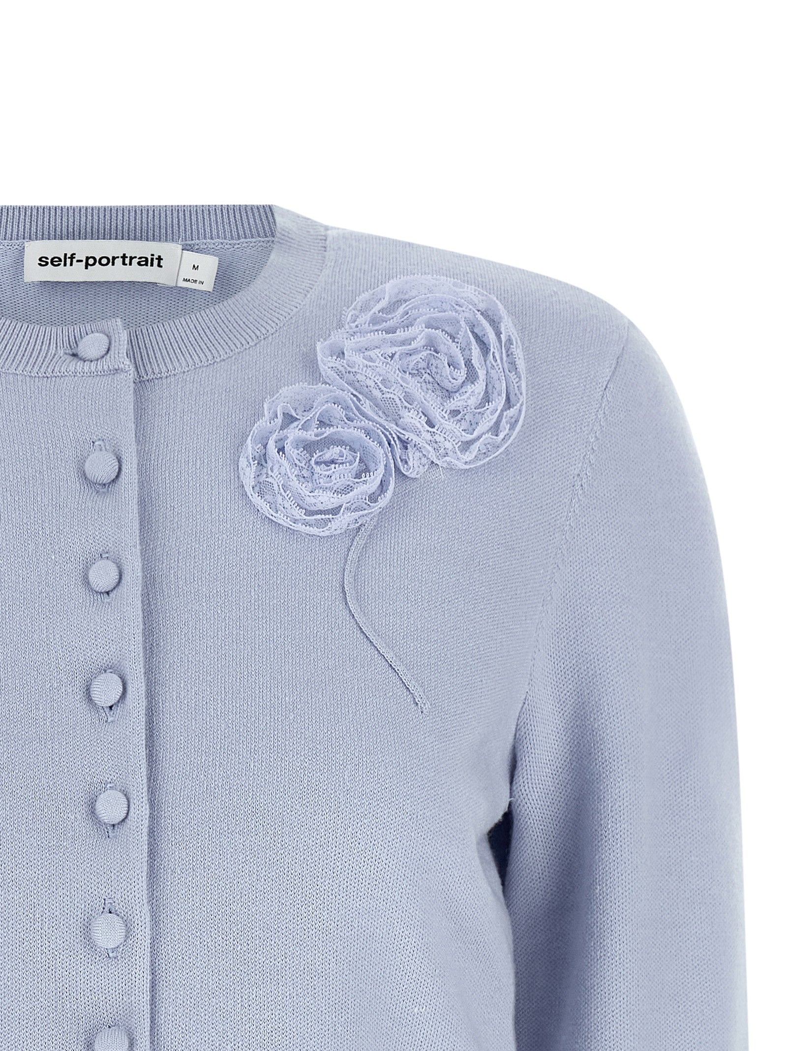 Elevate your elegance with the Self-Portrait Blue Flower Knit Cardigan, a masterpiece of tonal lace and luxurious fabric, perfect for sophisticated styling.