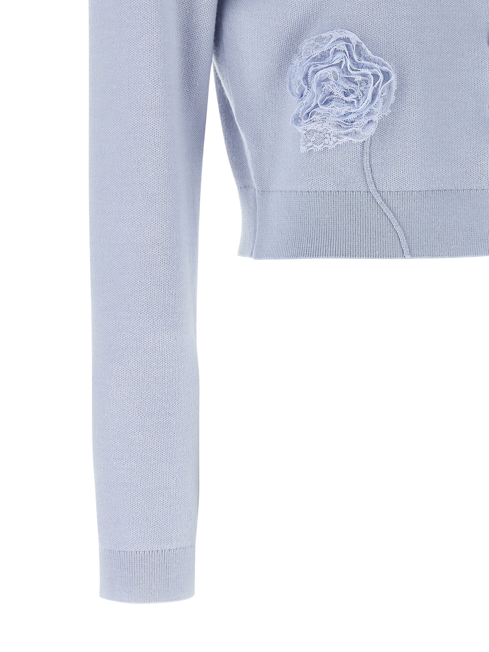 Elevate your elegance with the Self-Portrait Blue Flower Knit Cardigan, crafted from luxurious stretch knit, adorned with sculptural lace flowers for timeless sophistication.