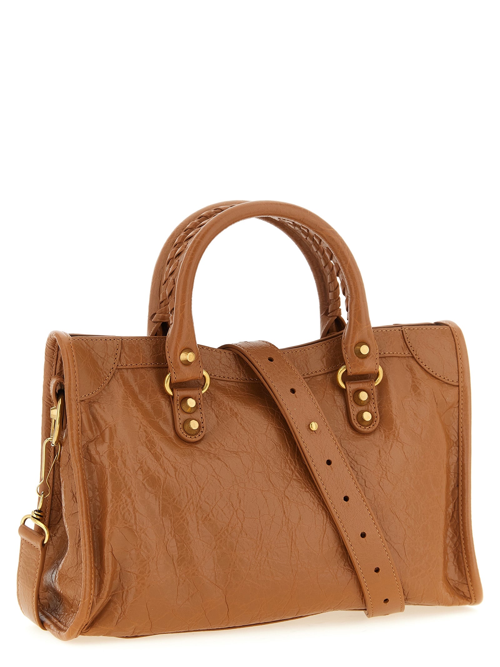 Discover the Balenciaga Brown Lamb Leather Handbag, a masterpiece of luxurious craftsmanship, designed for those who embody elegance and sophistication.