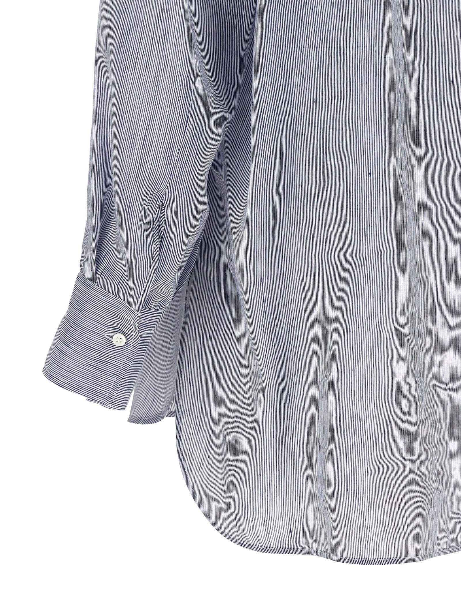 Elevate your wardrobe with the Brunello Cucinelli Blue Linen Blouse, a luxurious blend of linen and silk that embodies modern sophistication and timeless elegance.