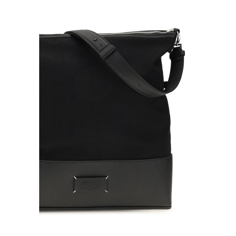 Discover the Maison Margiela Black Calf Leather Bos Taurus Shoulder Bag, a harmonious blend of exquisite craftsmanship and timeless elegance, perfect for the discerning individual.