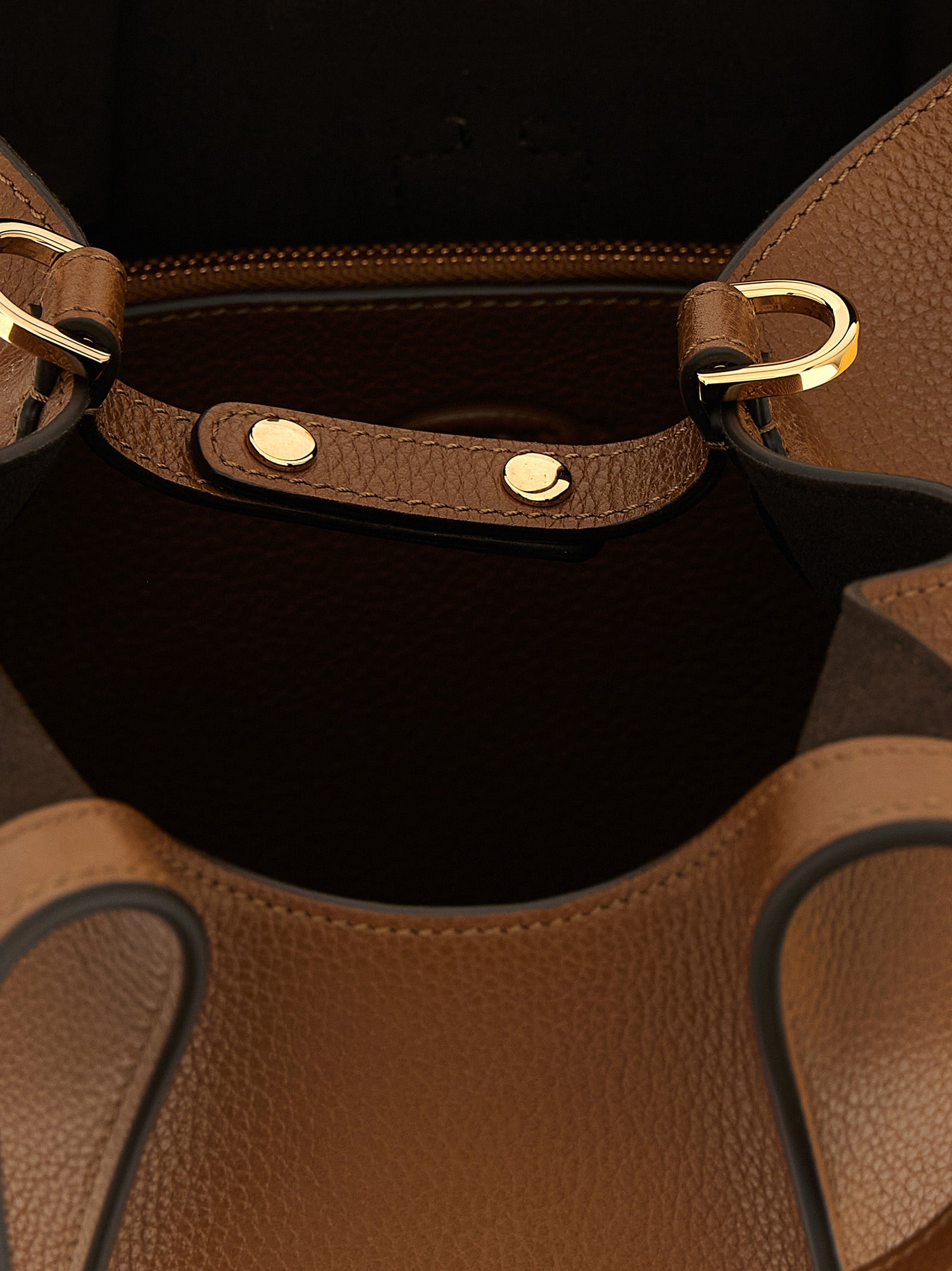 Elevate your style with the Tod's Brown Calfskin Handbag, a luxurious blend of Italian craftsmanship and timeless elegance, perfect for any occasion.
