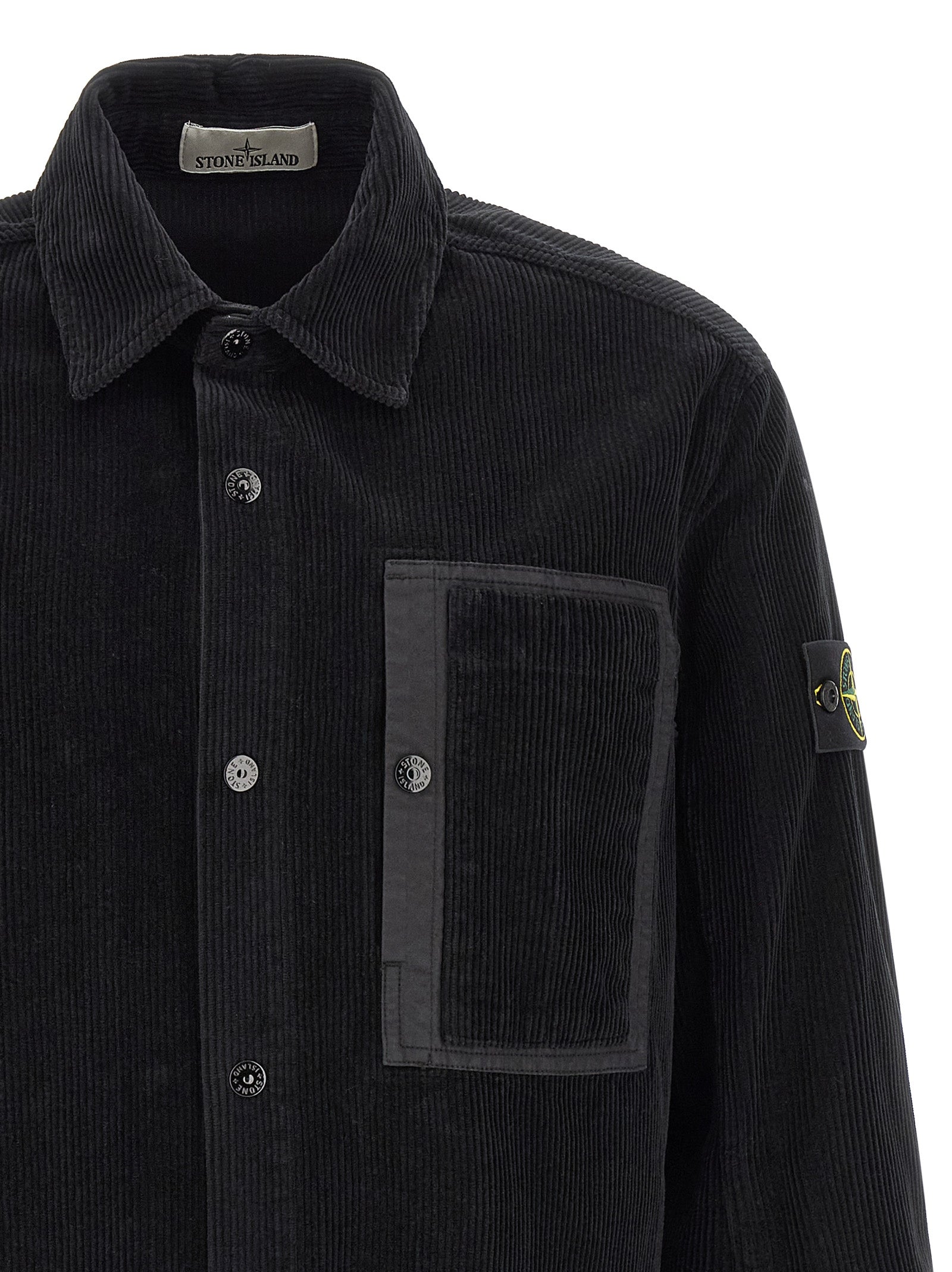 Elevate your wardrobe with the Stone Island Black Cotton Blouse, a luxurious garment-dyed corduroy masterpiece that embodies contemporary sophistication and timeless elegance.