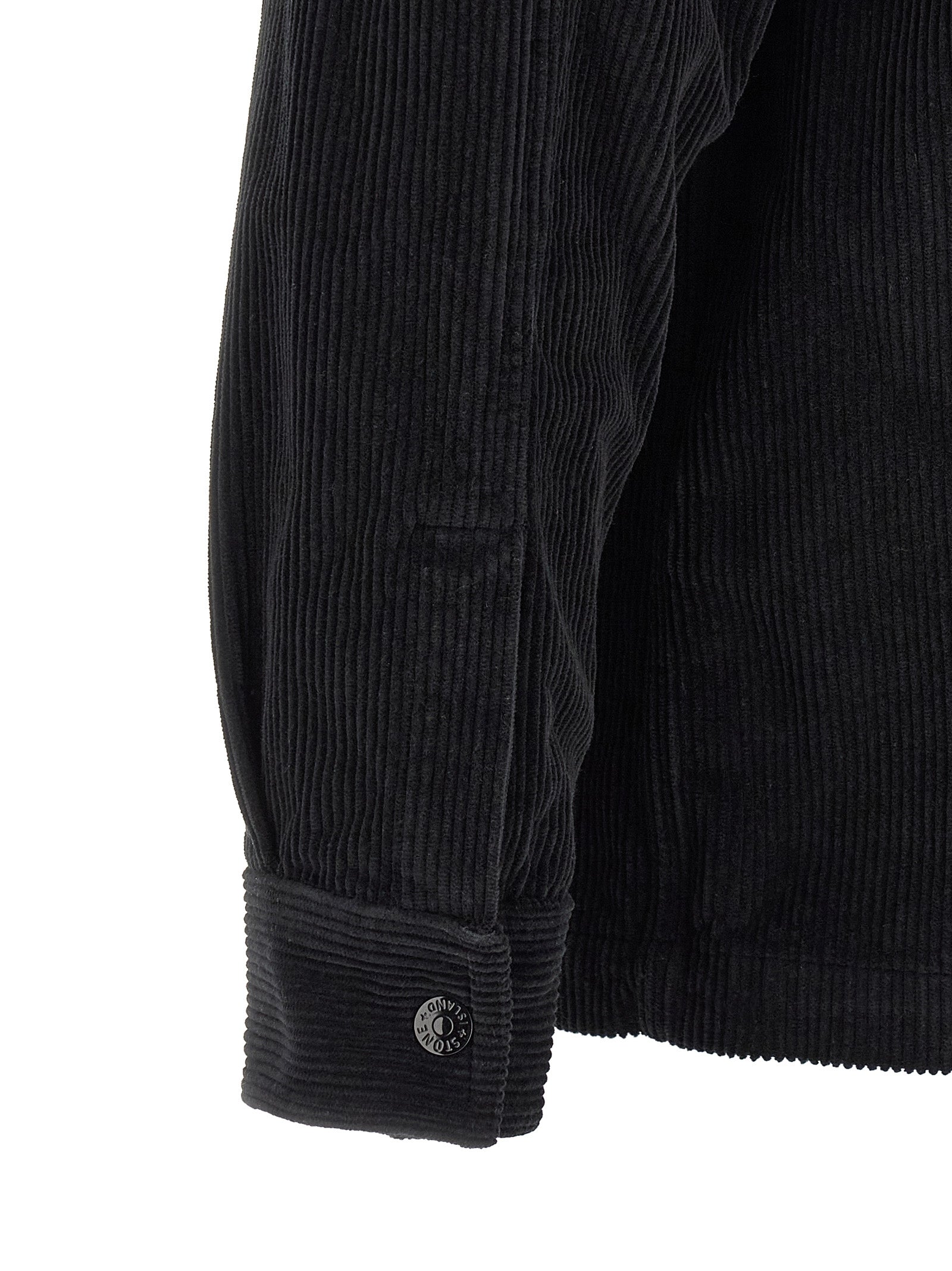 Indulge in the Stone Island Black Cotton Blouse, a luxurious garment-dyed masterpiece crafted from 100% cotton corduroy, embodying timeless elegance and sophistication.