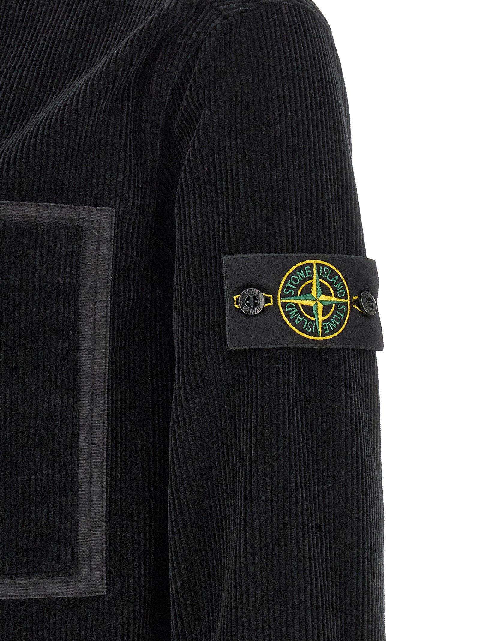 Elevate your wardrobe with the Stone Island Black Cotton Blouse, a luxurious blend of 100% cotton corduroy, embodying timeless elegance and contemporary sophistication.
