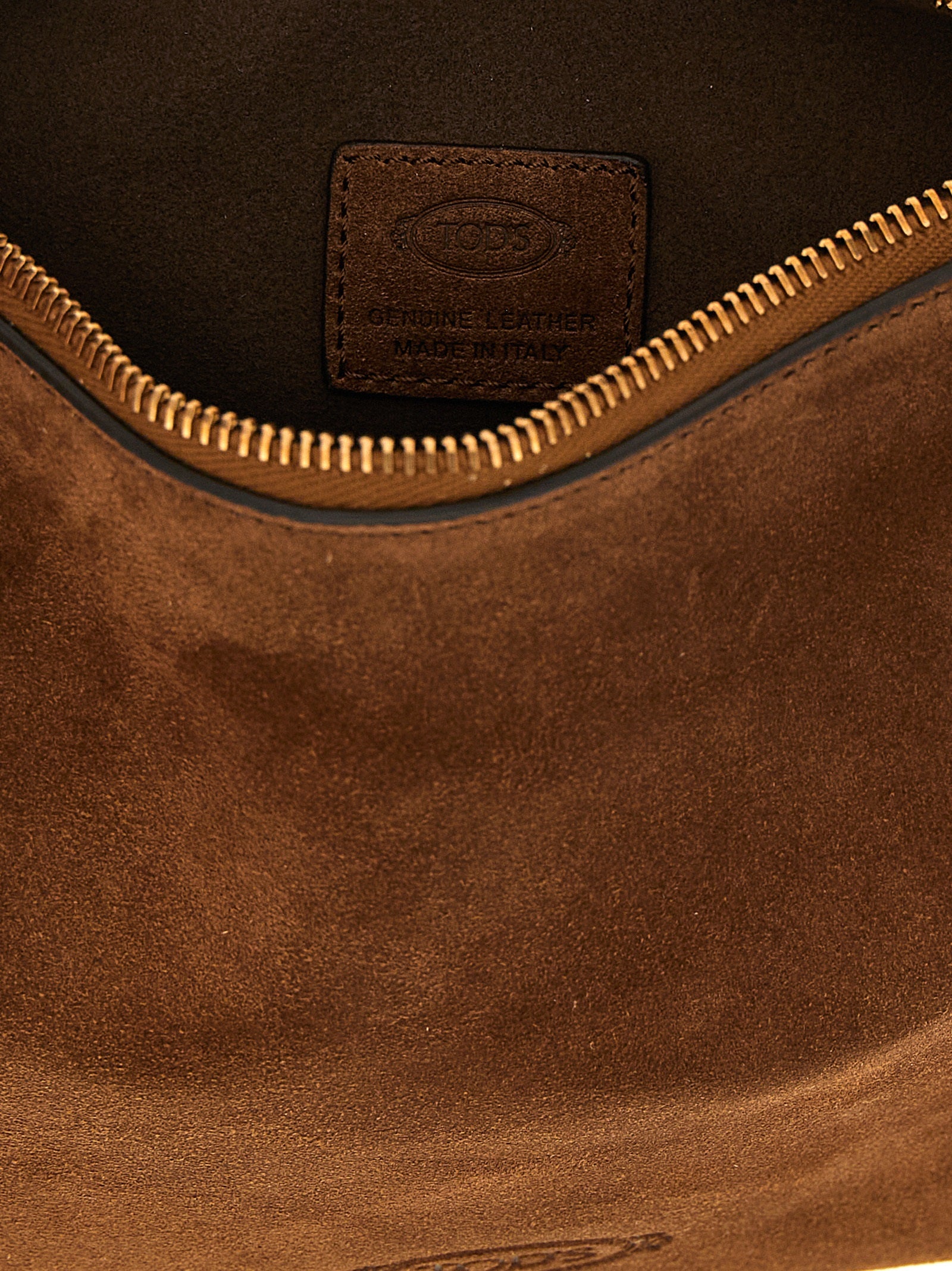 Discover the Tod's Brown Calfskin Shoulder Bag, a masterpiece of Italian craftsmanship in luxurious calfskin, embodying sophistication and timeless elegance for the discerning individual.