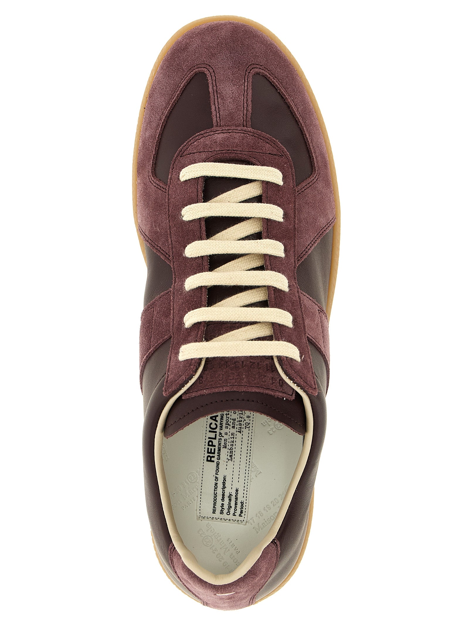 Indulge in the exquisite Maison Margiela Bordeaux Calfskin Low Top Sneakers, where luxurious craftsmanship meets timeless elegance, perfect for the discerning individual.