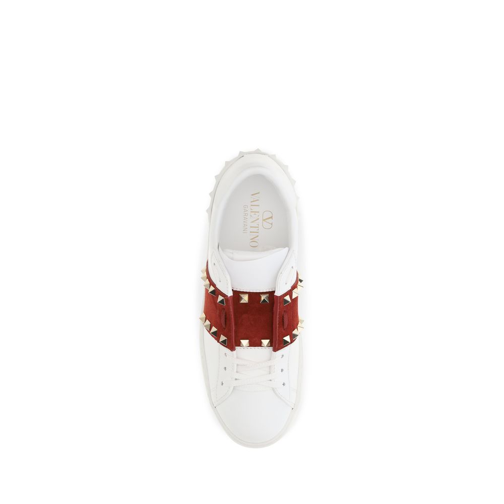 Experience the elegance of Valentino Garavani's White Calf Leather Bos Taurus Low Top Sneakers, where exquisite craftsmanship meets timeless luxury for the discerning individual.