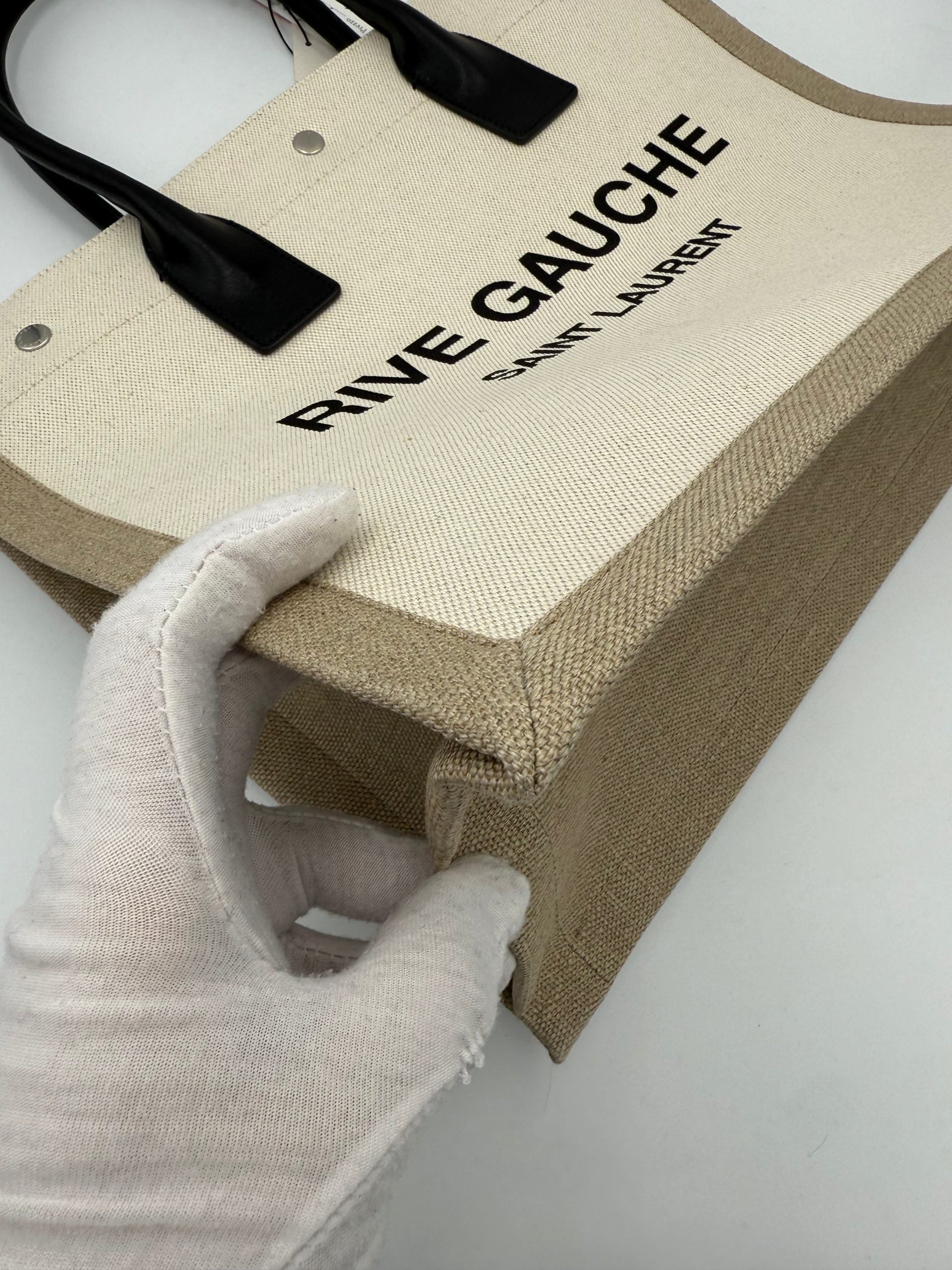 Experience the exquisite allure of the Saint Laurent Rive Gauche Medium Tote Bag, a timeless blend of luxury and functionality crafted from premium materials for the discerning individual.