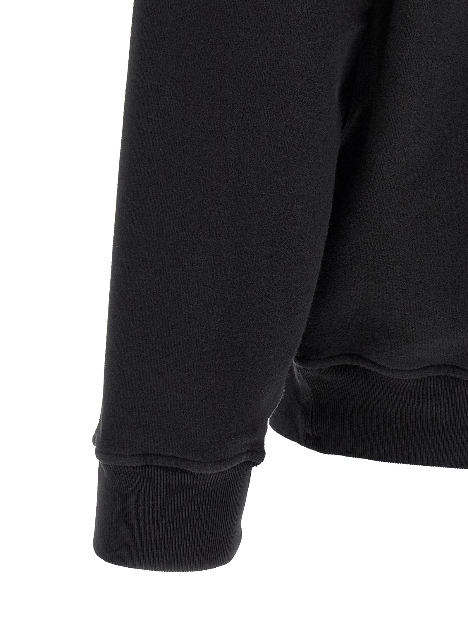 Experience the epitome of luxury with the Stone Island Black Cotton Sweatshirt, crafted from sustainable organic cotton for timeless elegance and unparalleled comfort.