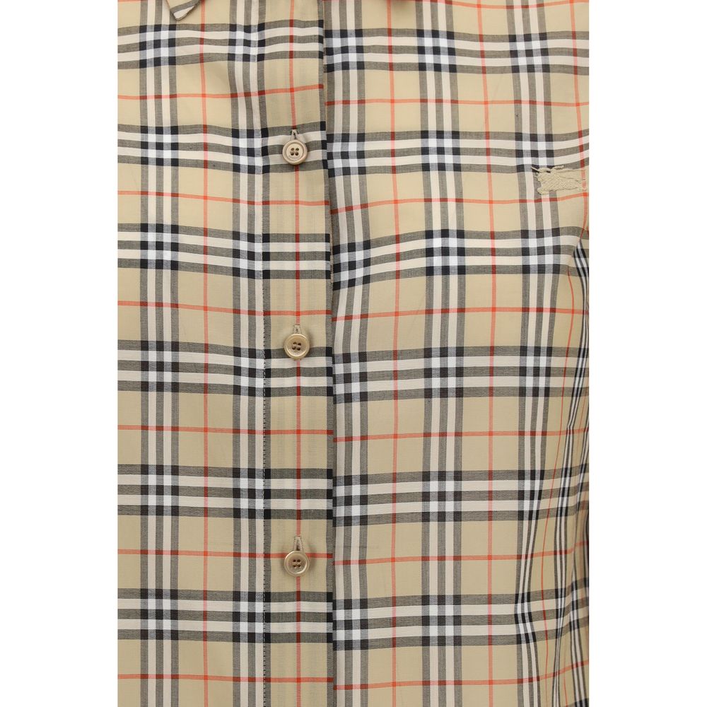 Experience the epitome of elegance with the Burberry Beige Cotton Pattern Shirt, crafted from 100% cotton, embodying timeless luxury and sophisticated allure.