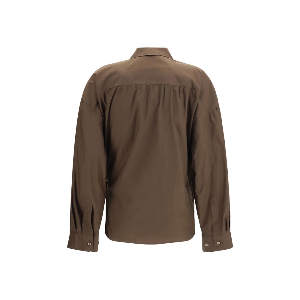 Indulge in the Lemaire Brown Cotton Shirt, a harmonious blend of cotton and silk, embodying refined craftsmanship and timeless elegance for the discerning individual.