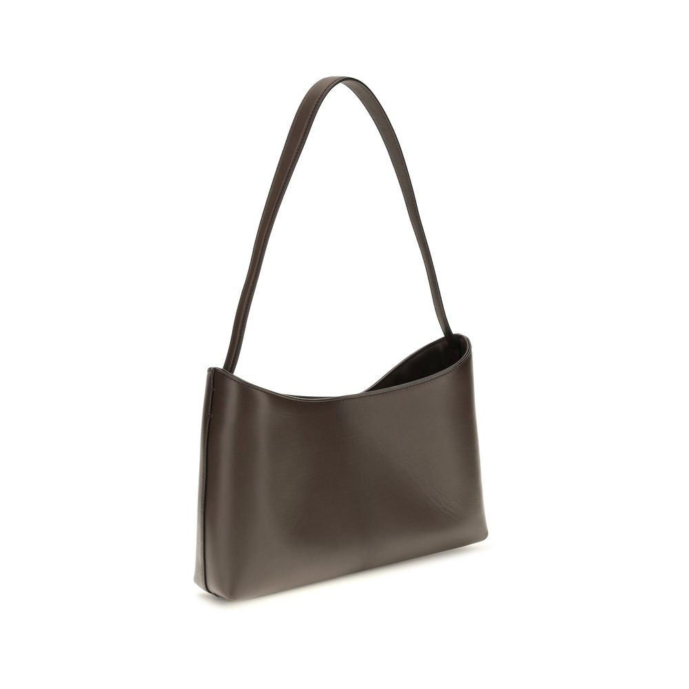 Discover The Row's Brown Calf Leather Bos Taurus Shoulder Bag, a timeless blend of sophistication and elegance, crafted for the discerning individual.