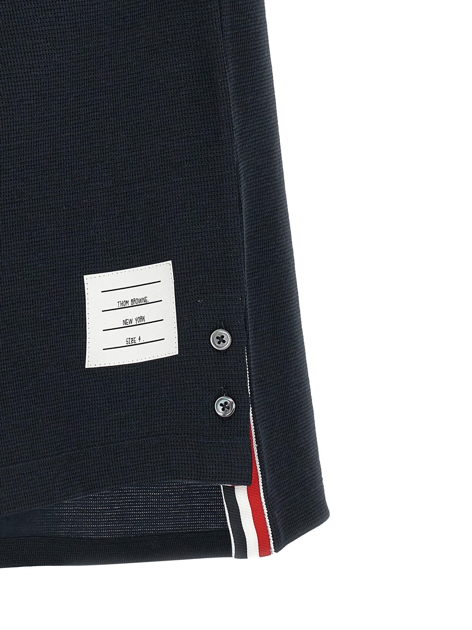Discover the Thom Browne Blue Cotton Polo Shirt, a masterpiece of Italian craftsmanship blending luxury and sophistication for the discerning individual.