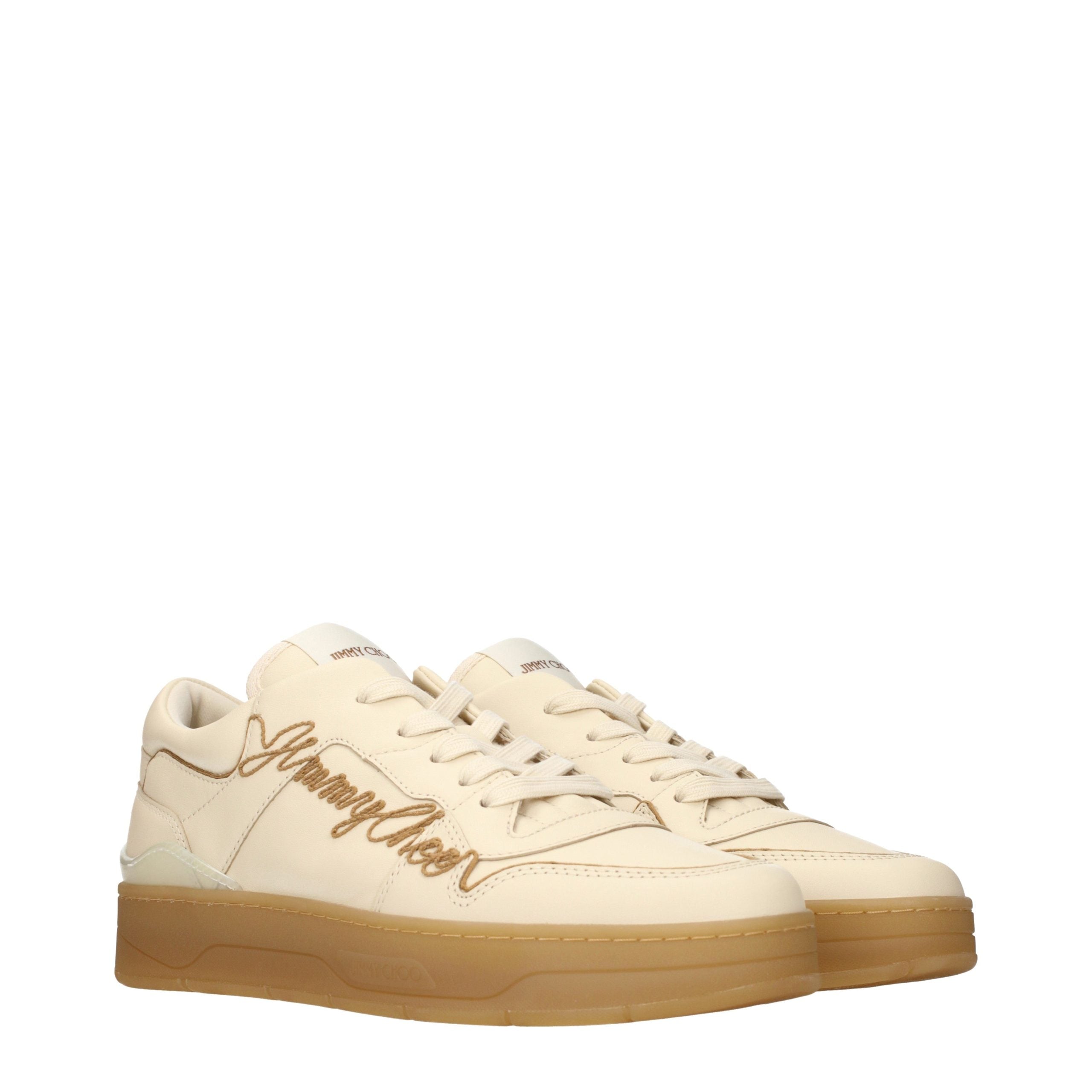 Elevate your style with Jimmy Choo's Beige Leather Low Top Sneakers, where exquisite craftsmanship meets timeless elegance, perfect for the discerning individual.