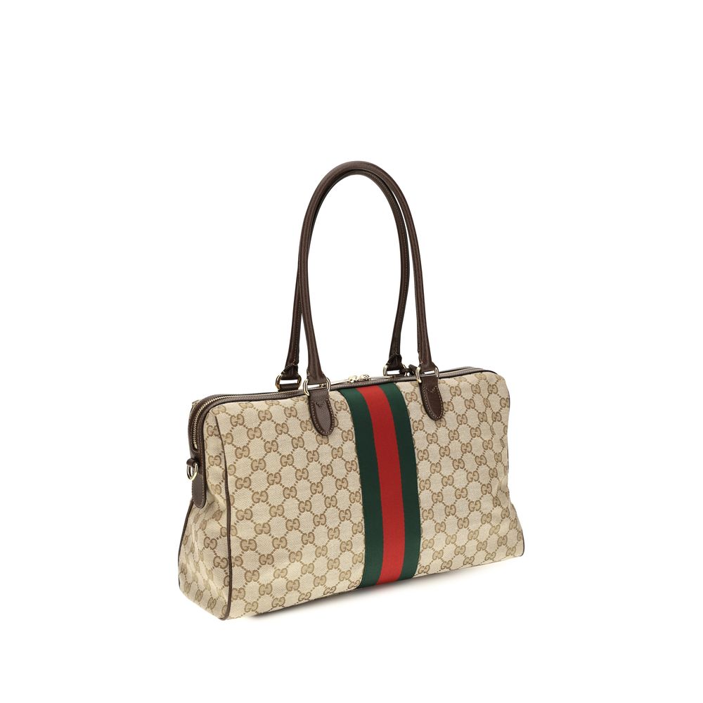 Discover the Gucci Beige Fabric Handbag, a timeless luxury piece crafted from iconic GG canvas, elevating your style with sophistication and elegance.